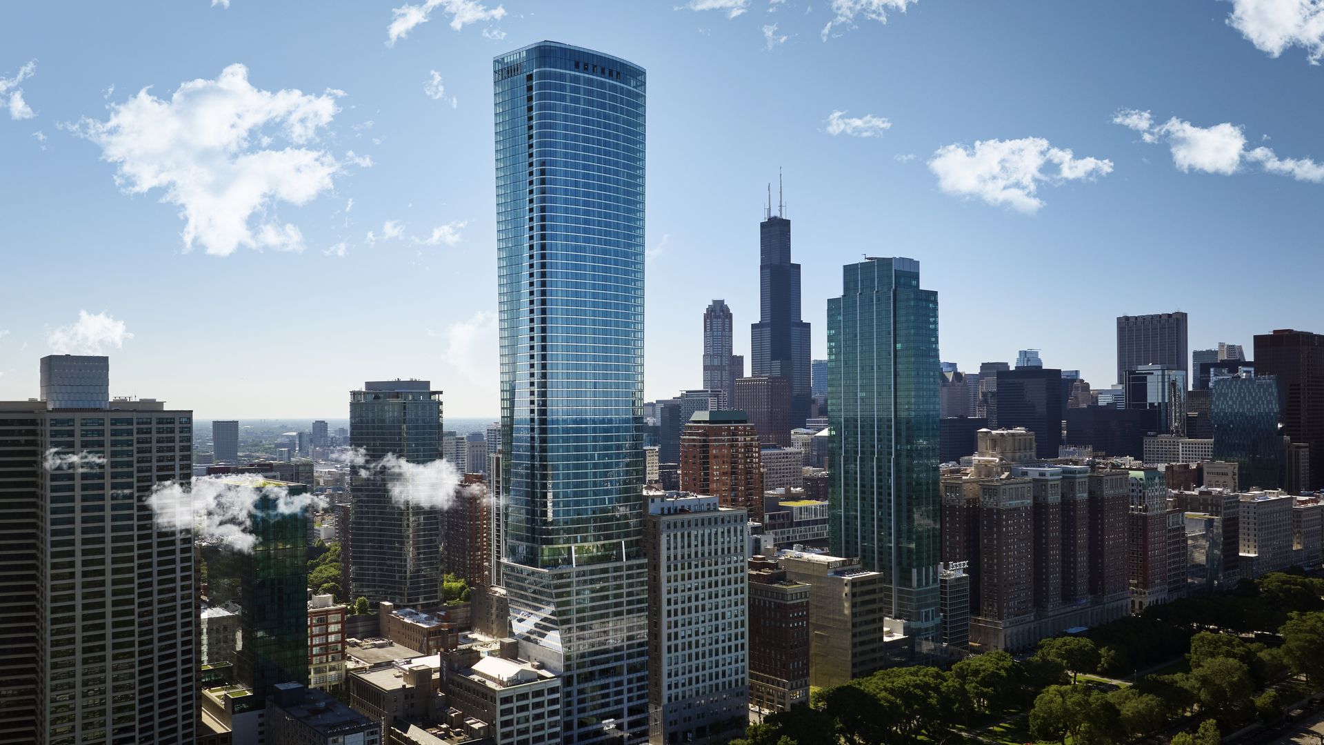 Photo of a skyscraper next to other skyscrapers 