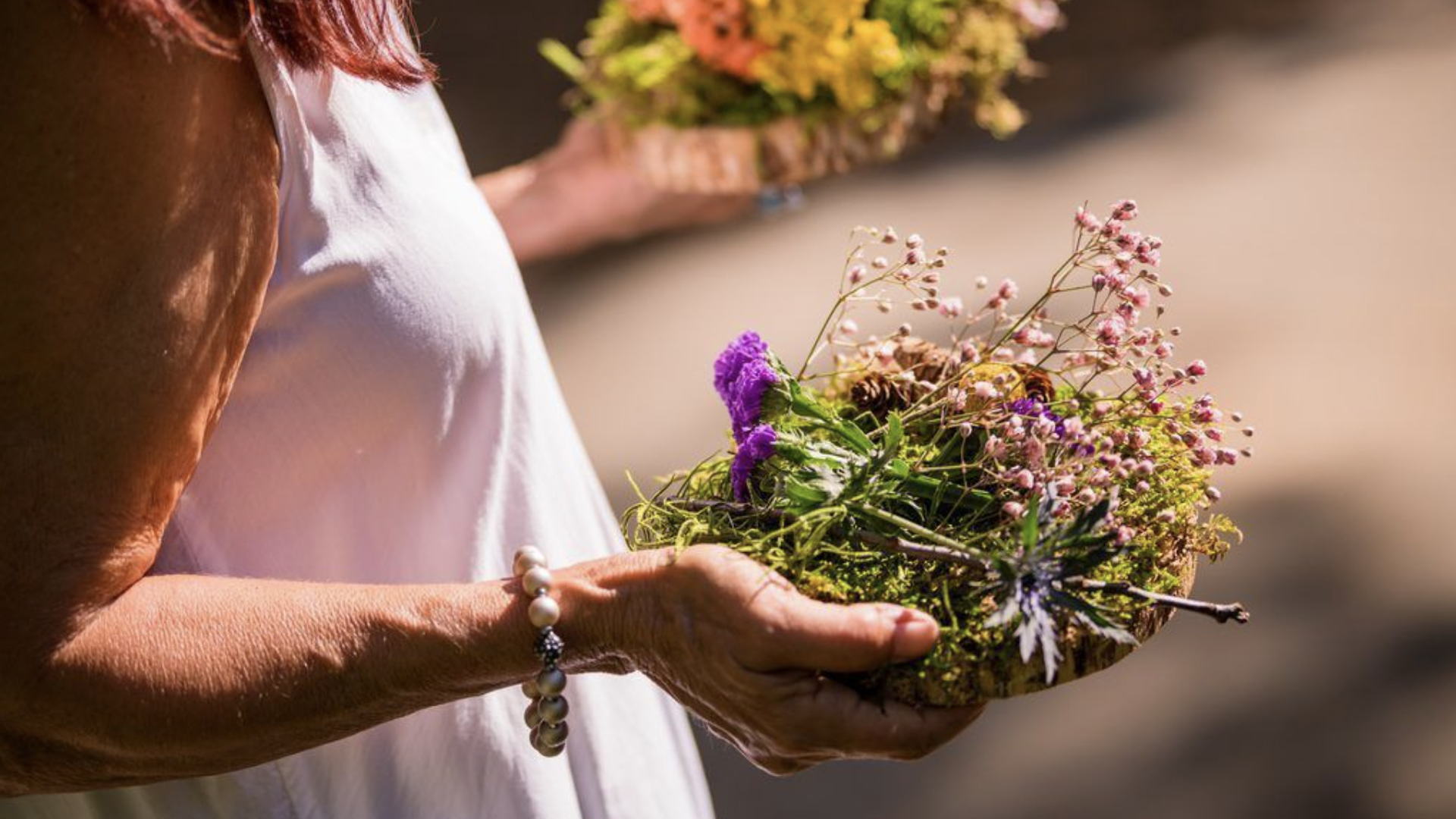 photo of person holding flowers