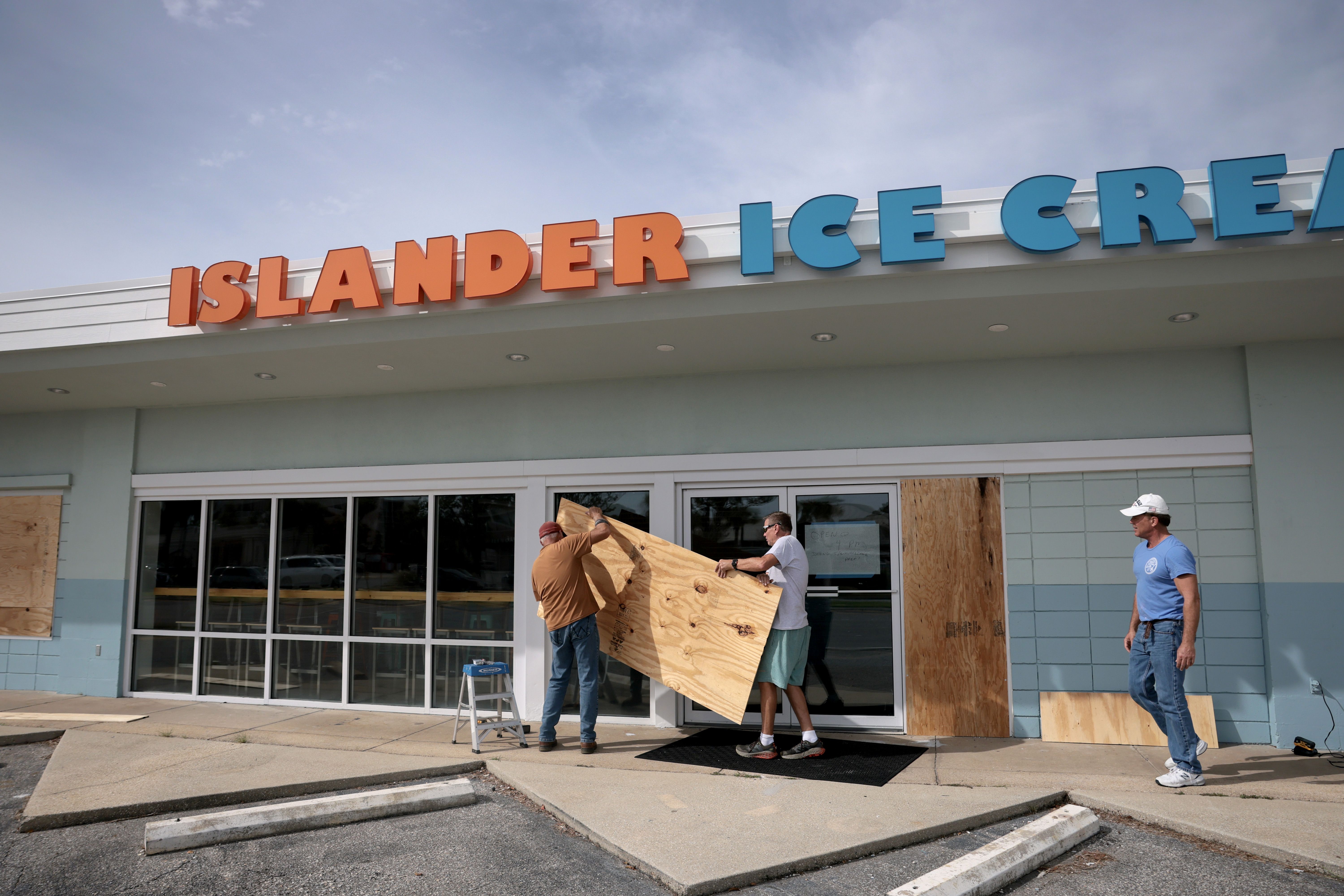Residents board up an ice cream shop yesterday in Gulf Breeze, Florida. Photo: Joe Raedle/Getty Images