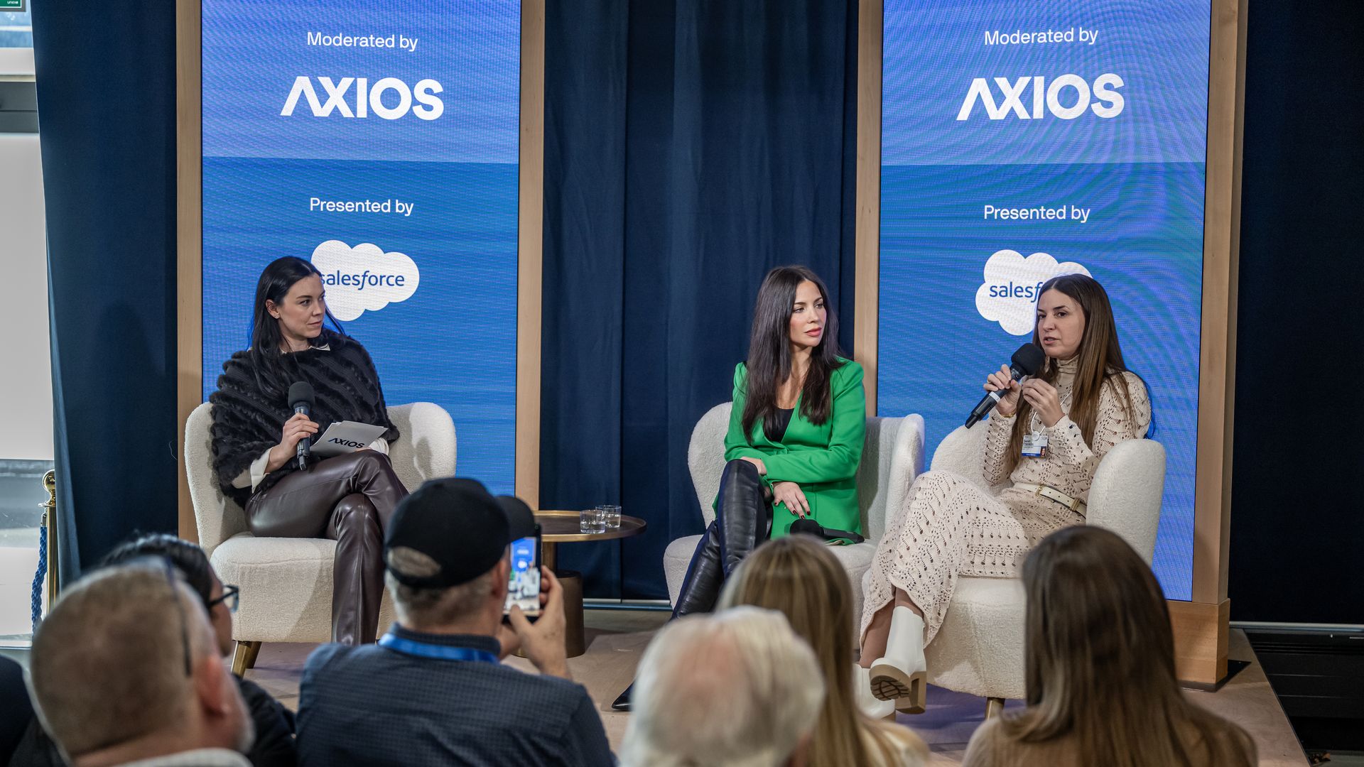 Photo of Lattice CEO Sarah Franklin and CCO Cheryl Sanclemente speaking on Axios' stage in Davos.