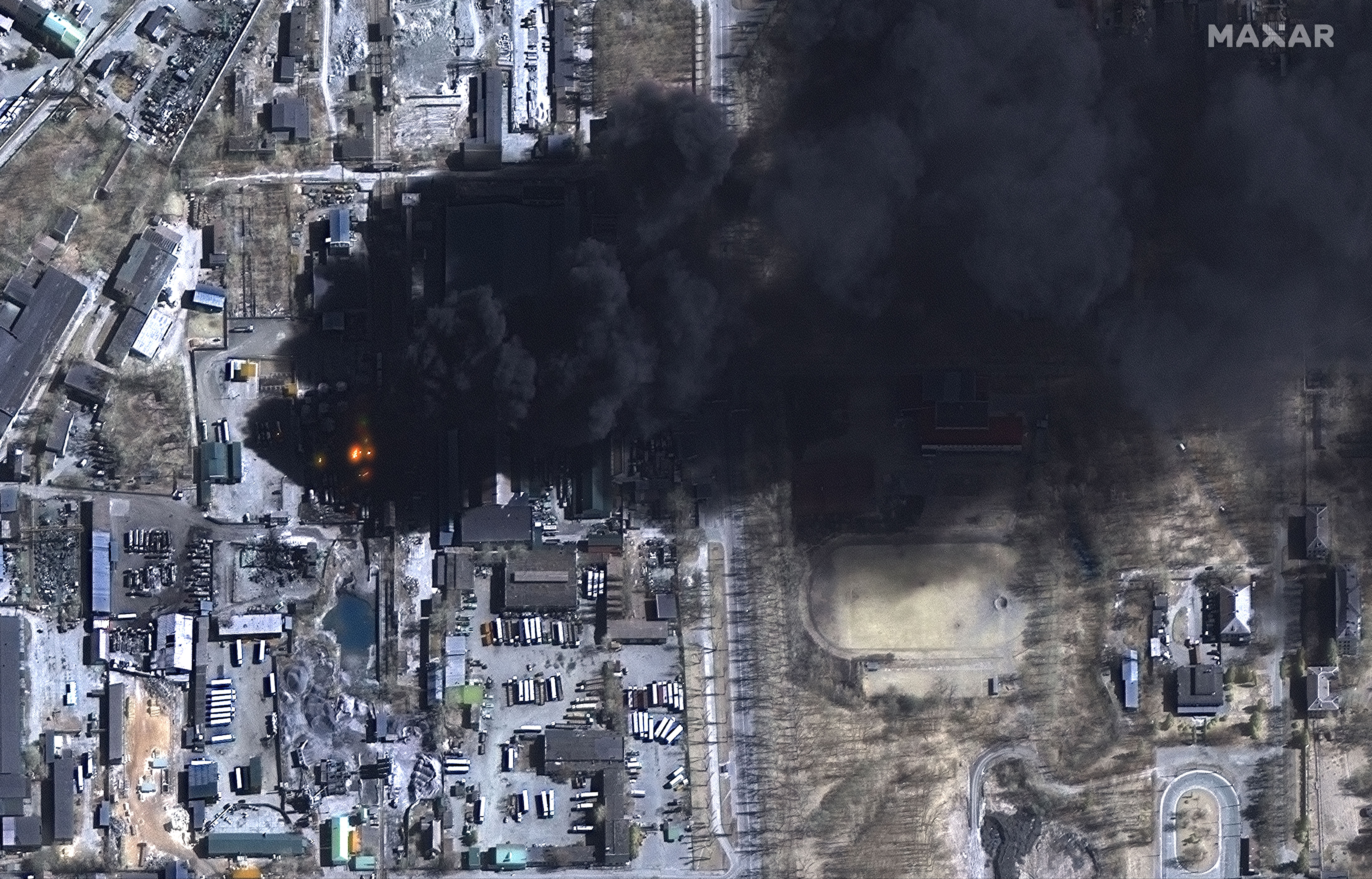 Multispectral images of burning storage tanks and damage in industrial area, Chernihiv