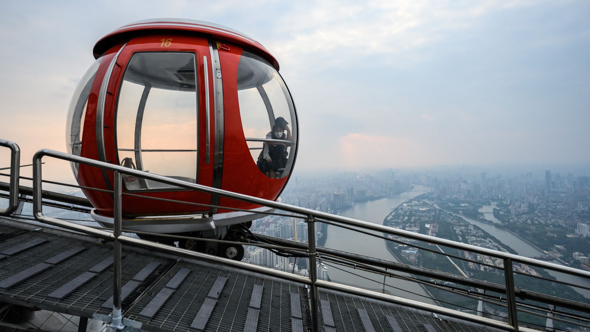 Tourists take ferris wheel at the top of Guangzhou Tower on September 26, 2022.