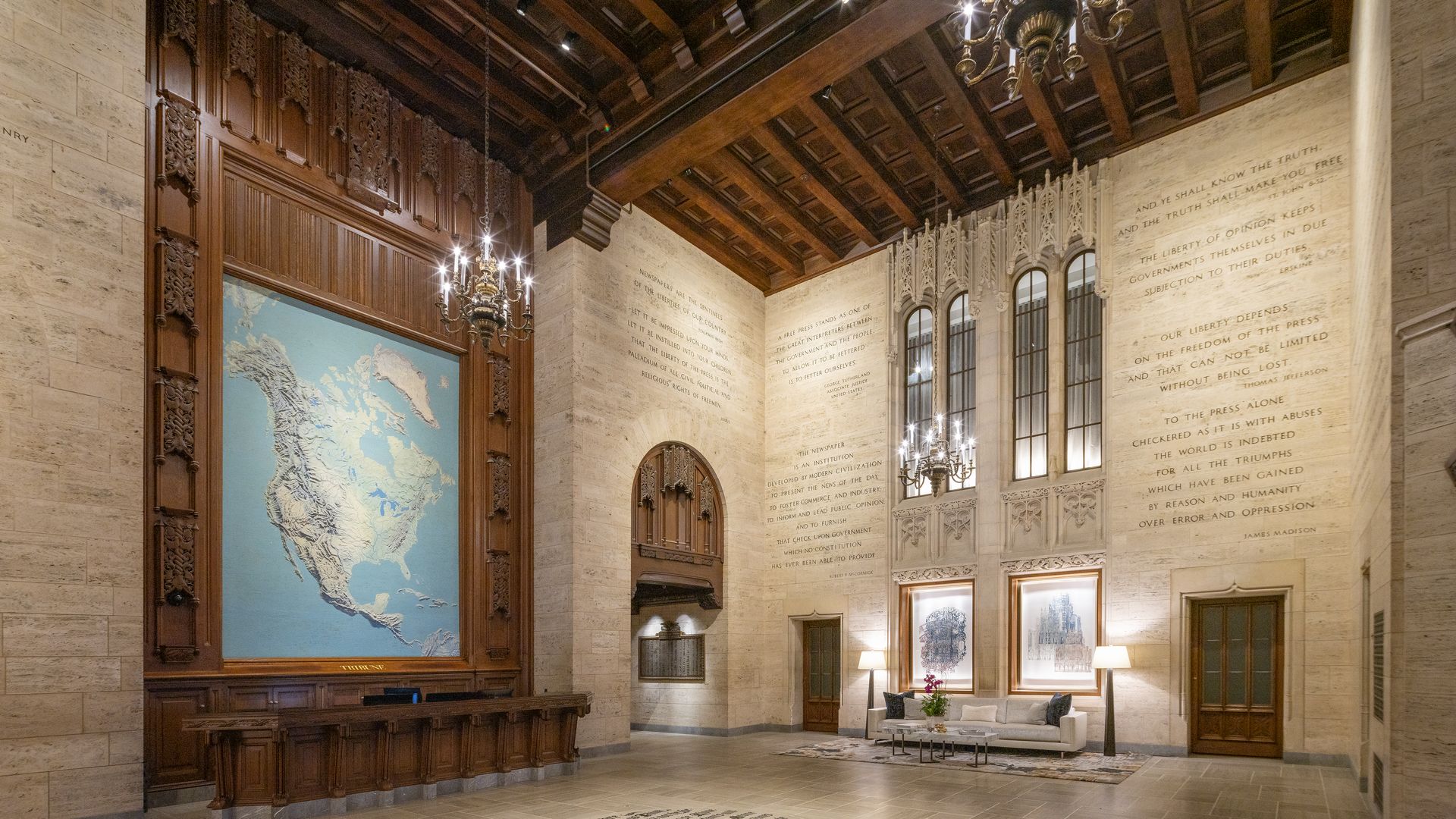 Photo of a lobby with a map and quotes on the wall 