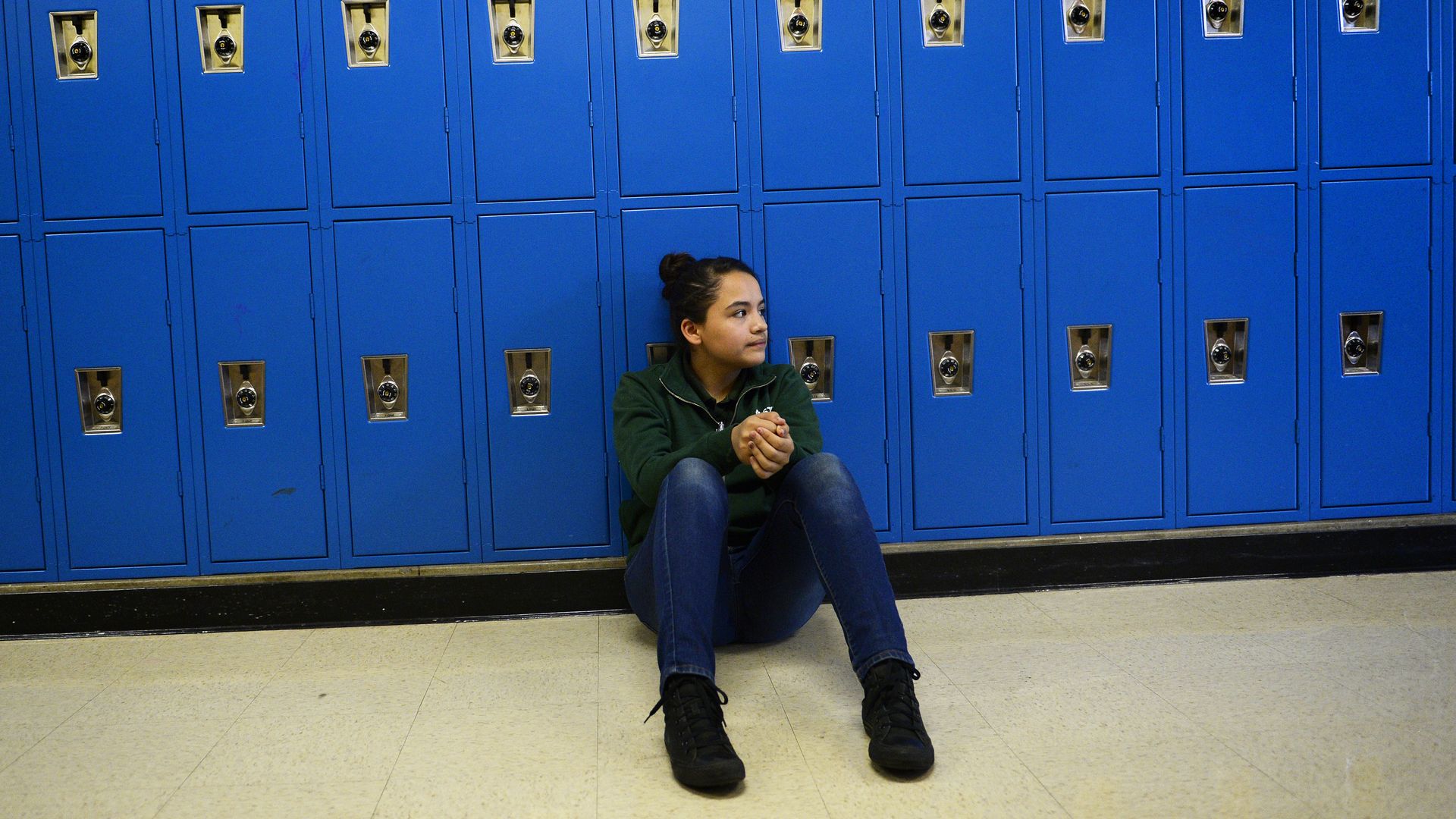 Stephanie Nava-Moreno, a seventh grader, rests at Strive Sunnyside charter school in northwest Denver amid a fight over school boundaries in 2015.