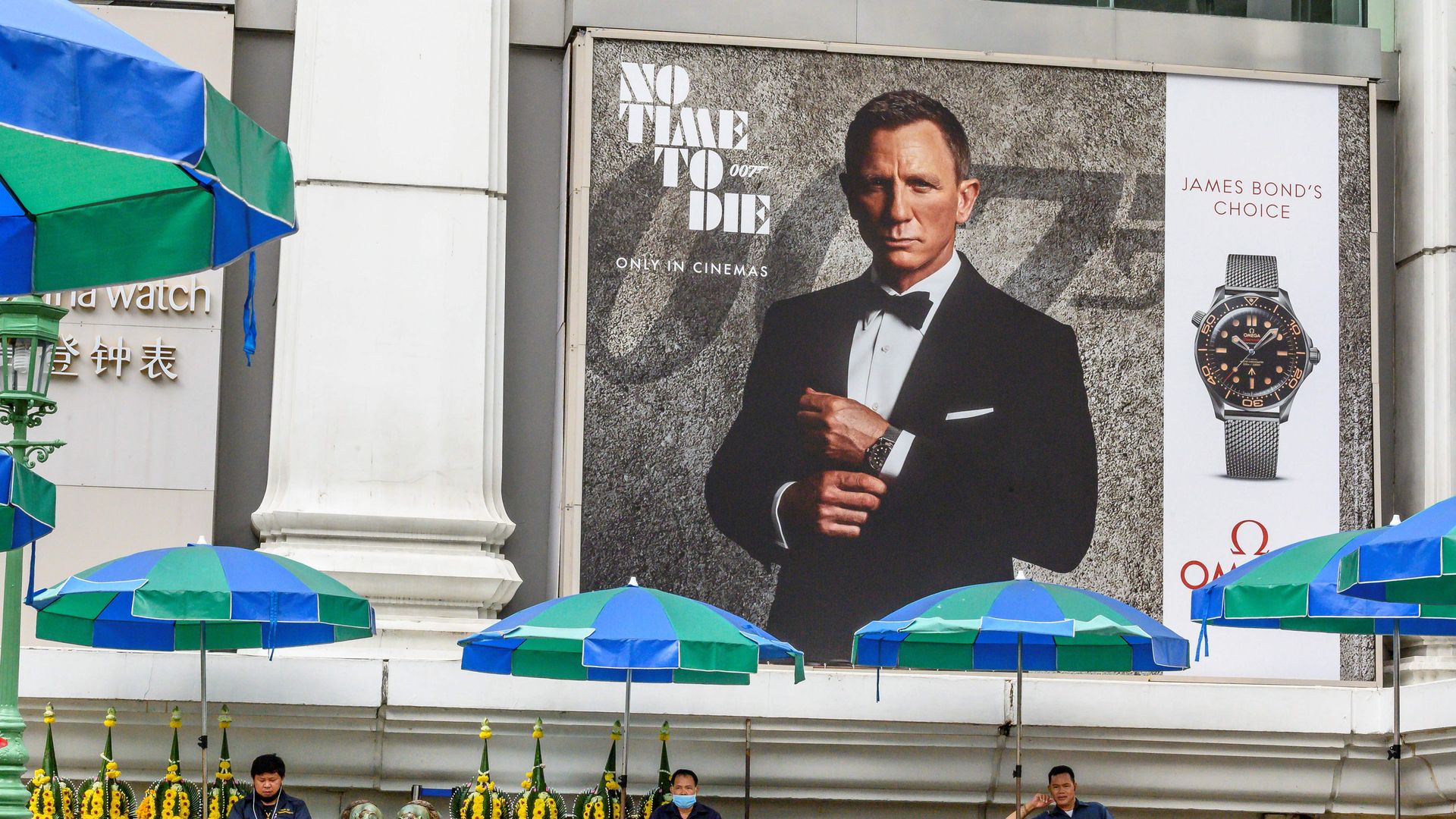 an advertisement poster featuring Daniel Craig in the new James Bond movie "No Time to Die" in Bangkok 