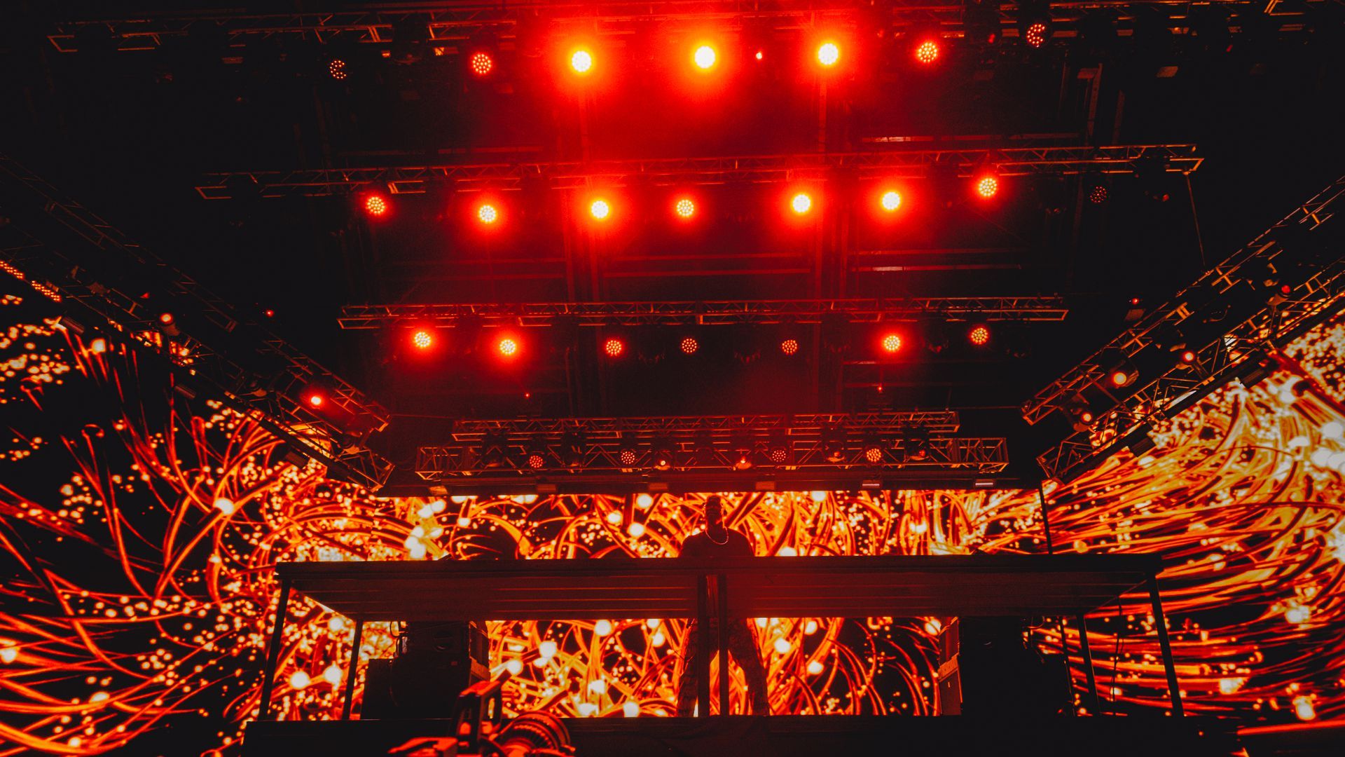 Black Coffee performing on a large stage with many lights at Coachella in April.