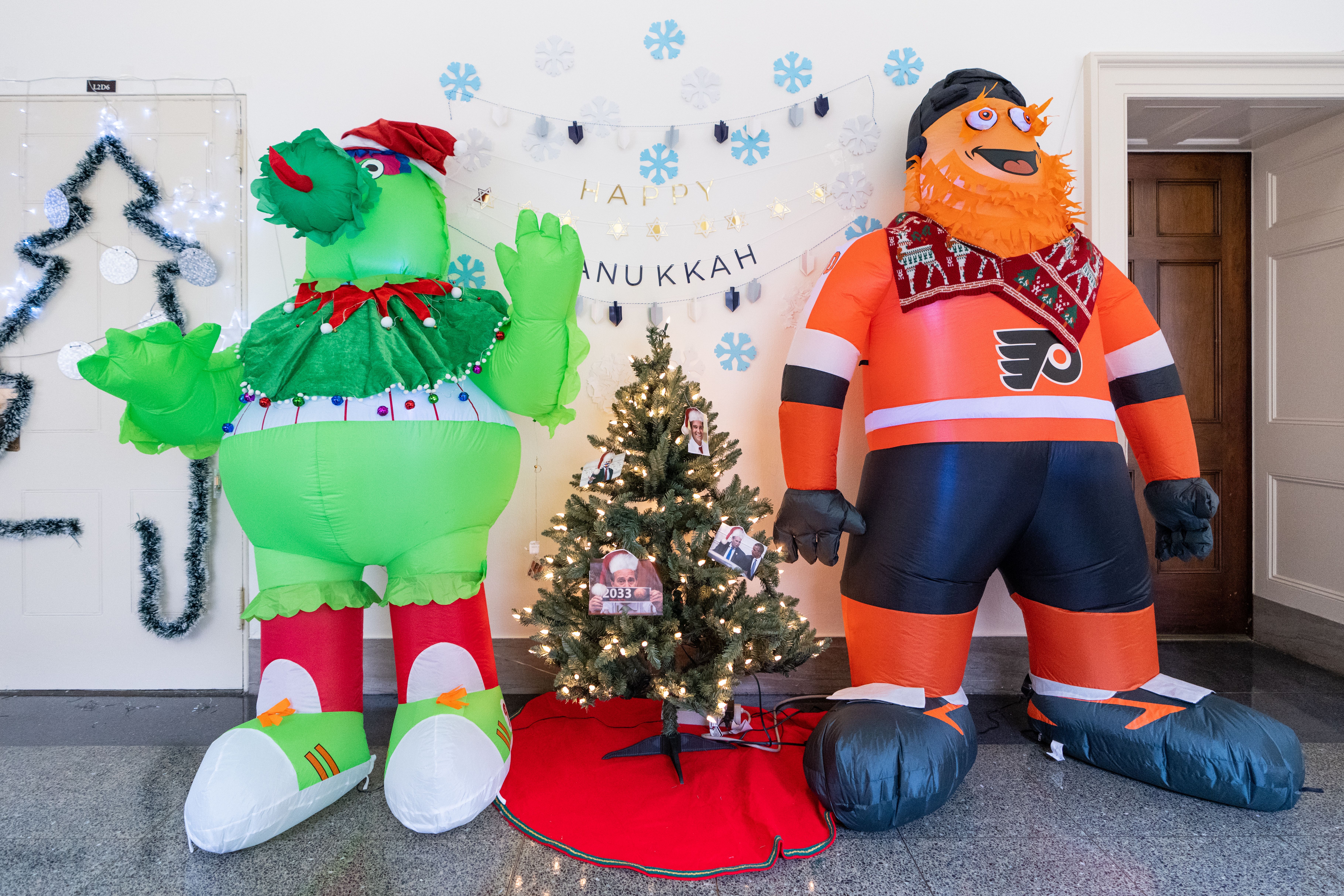 Philly sports mascots serve as Hanukkah and Christmas decorations in the hallway in front of U.S. Rep. Mary Gay Scanlon's office in Congress.