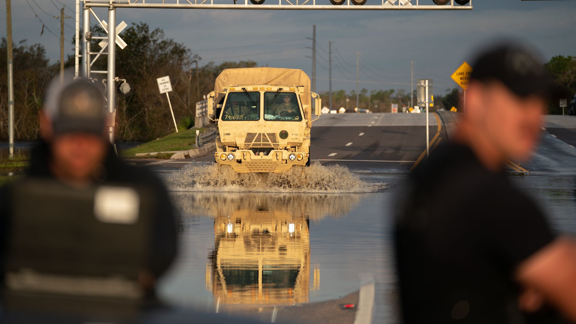 National Guard vehicle drives through floodwaters from the Peace River on October 4, 2022 in Arcadia, Florida.