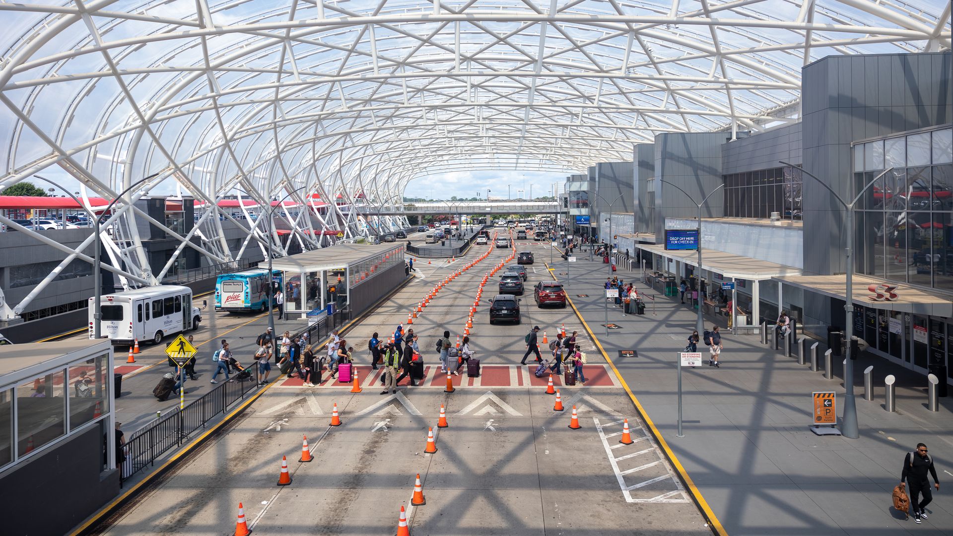 Travelers are seen going through Hartsfield Jackson International Airport in Atlanta, Georgia on July 2nd, 2022.