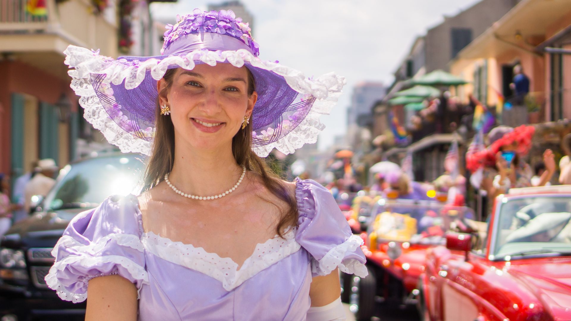 Photo shows a woman in a purple bonnet.