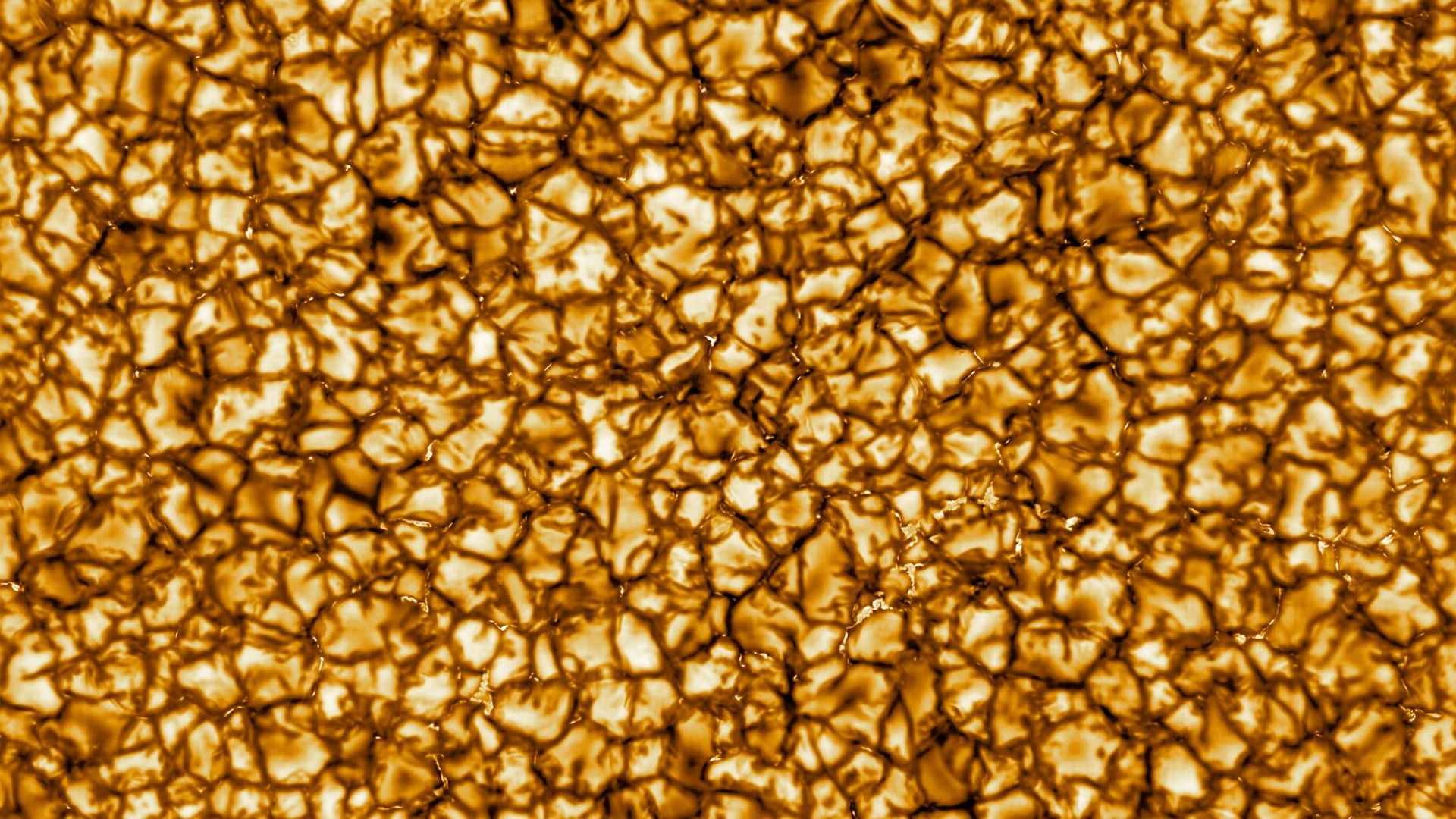 A photo showing the Sun's surface as it boils with yellow plasma