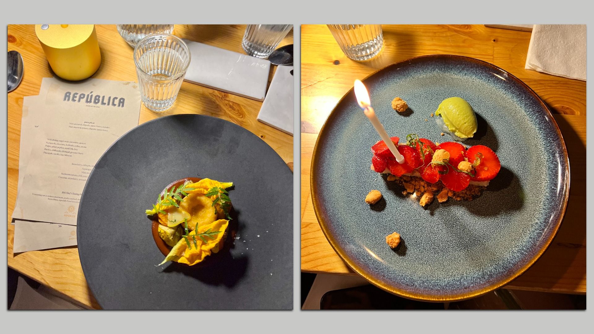 Two plated dishes on wooden table; left has a dark plate with a yellow flower garnish and a menu labeled REPÚBLICA; right has a blue plate with strawberries, crumbs, a green scoop, and a lit candle.