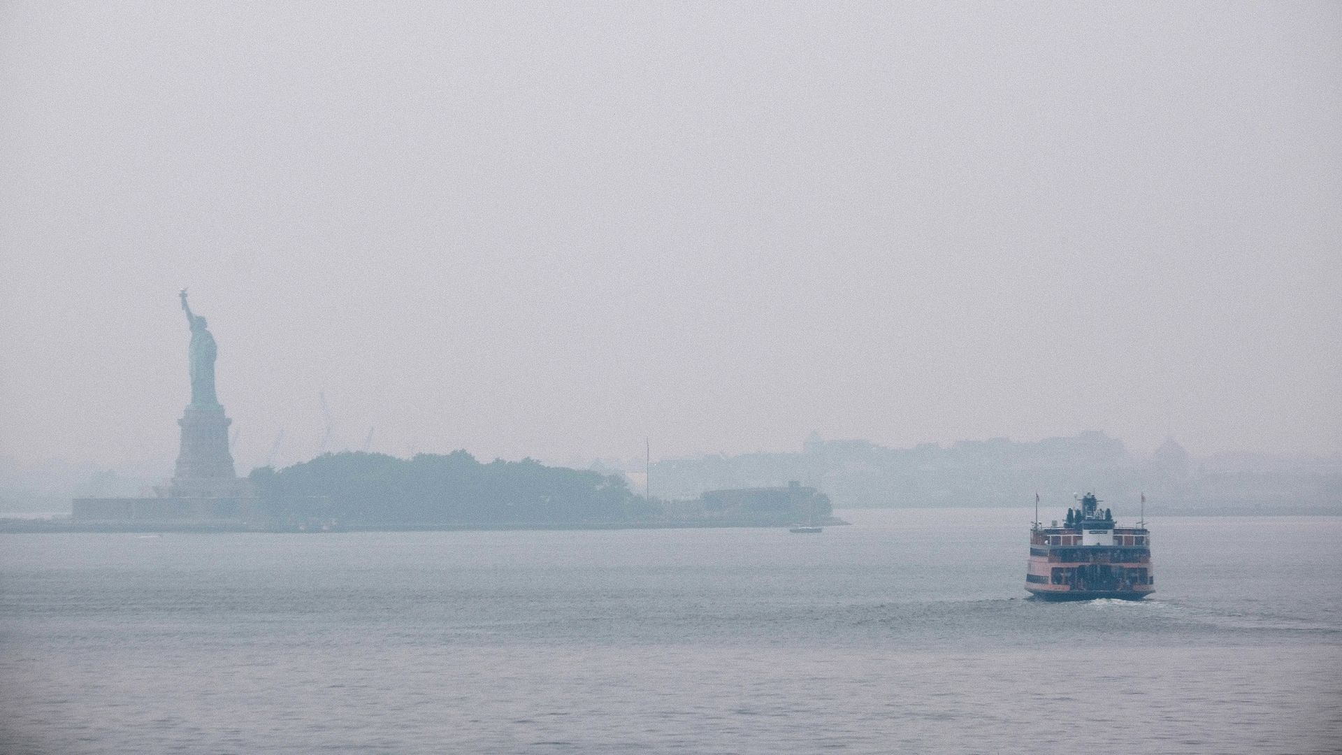  The Statue of Liberty sits behind a cloud of haze on July 20, 2021 in New York City. 