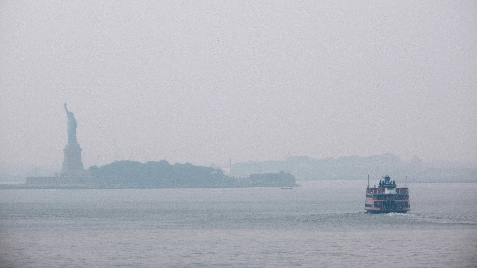 The Statue of Liberty sits behind a cloud of haze on July 20, 2021 in New York City.