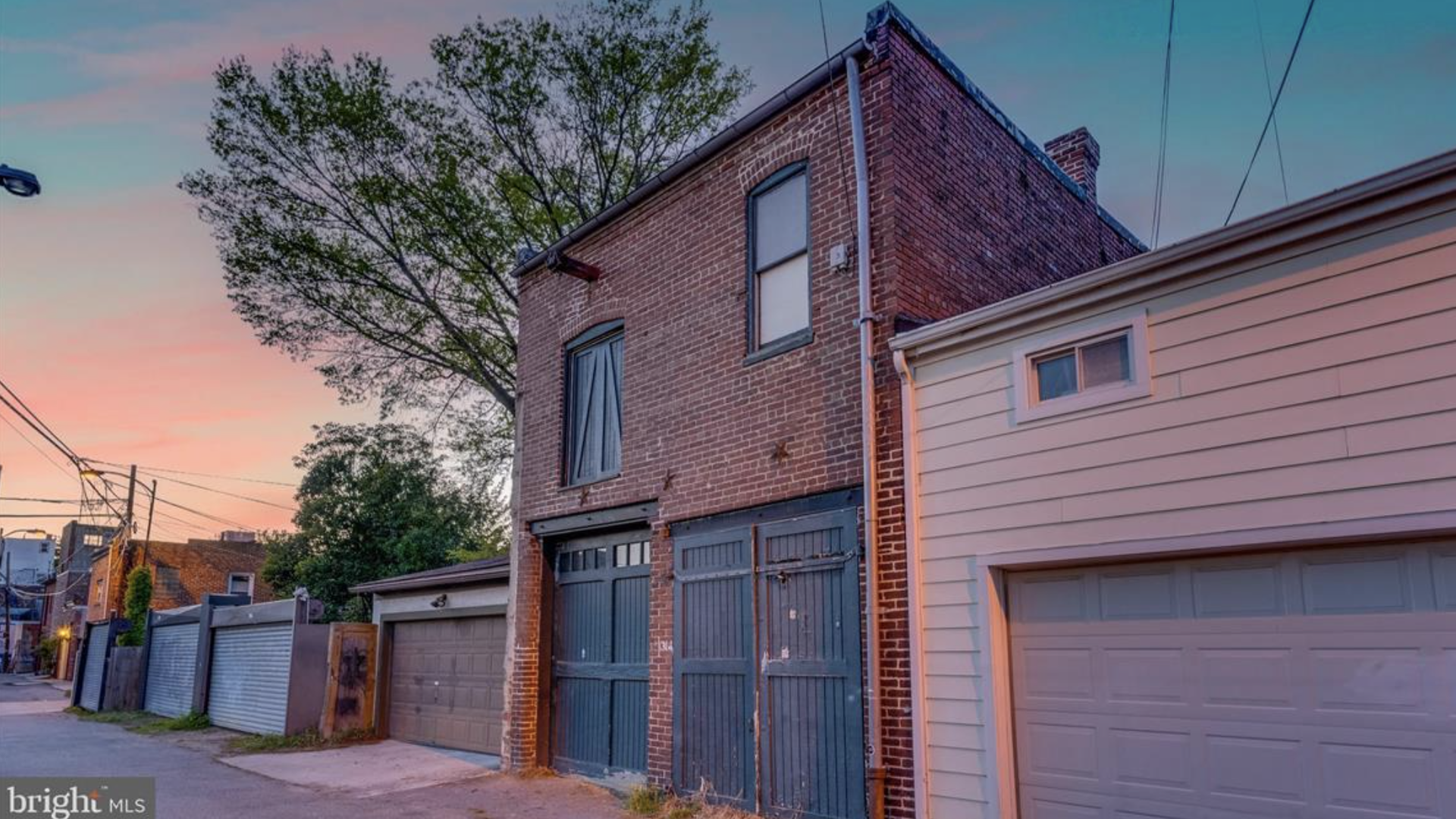 A D.C. alley lined with garages and carriage houses.