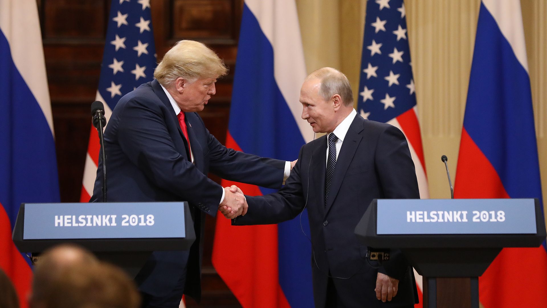 Donald Trump, left, shakes hands with Vladimir Putin, Russia's President, during a news conference in Helsinki, Finland, on Monday, July 16, 2018