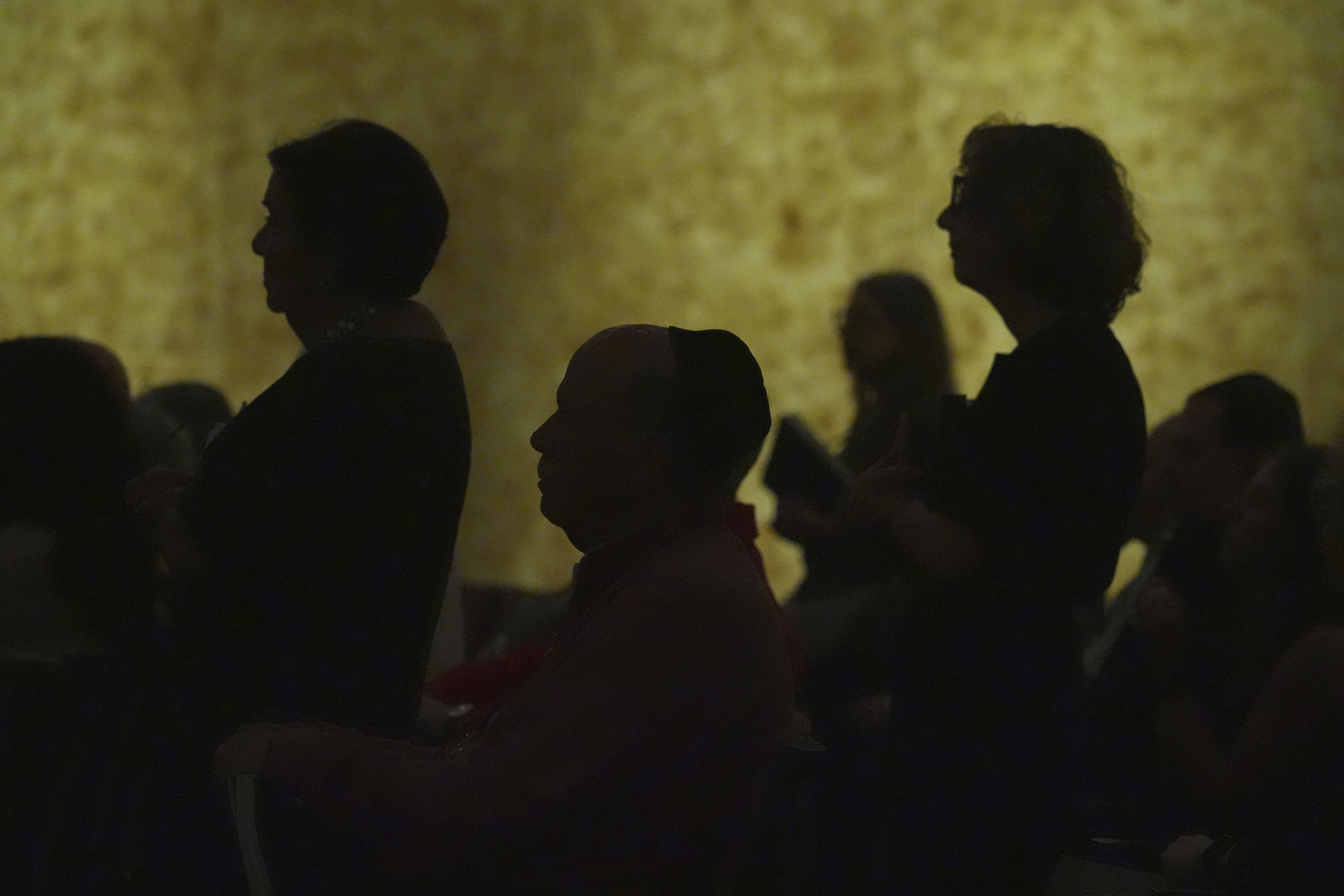 Worshipers attend a Shabbat service at Temple Beth Sholom last weekend in Miami Beach, Fla.