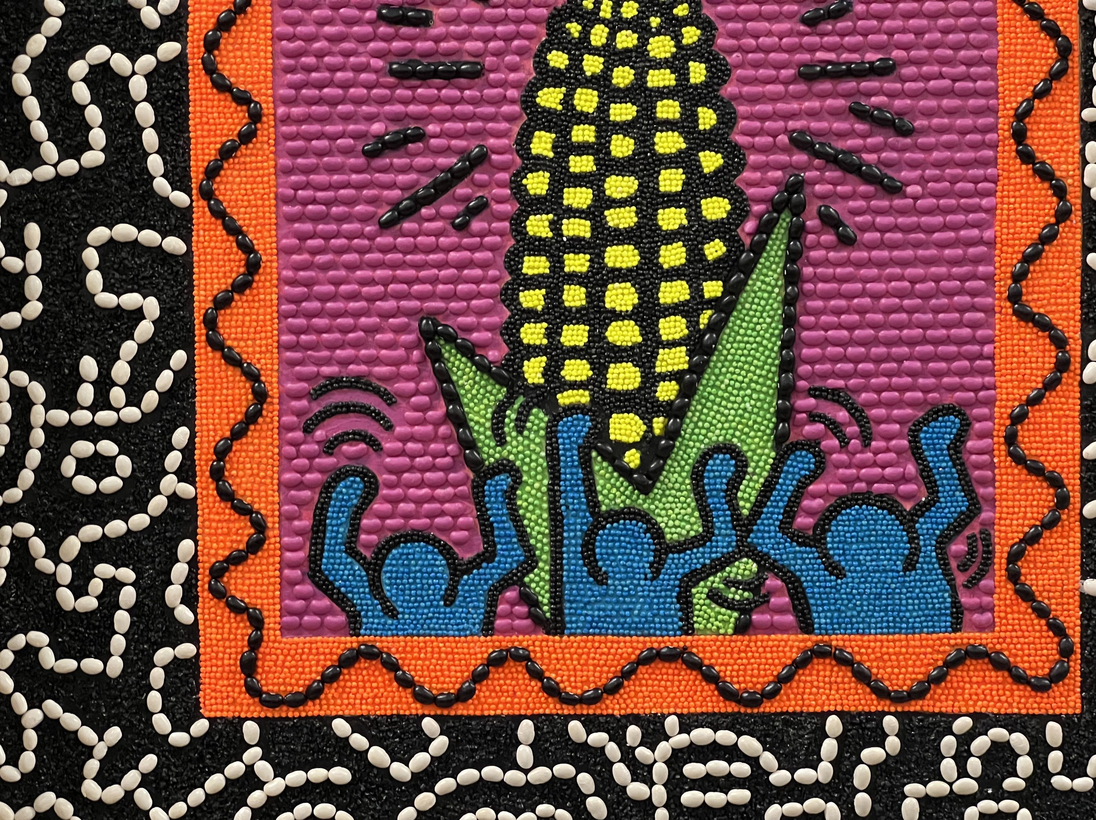 A seed art piece depicting neon-colored corn cob with dancing artistic figures in the style of Keith Haring on a magenta background.