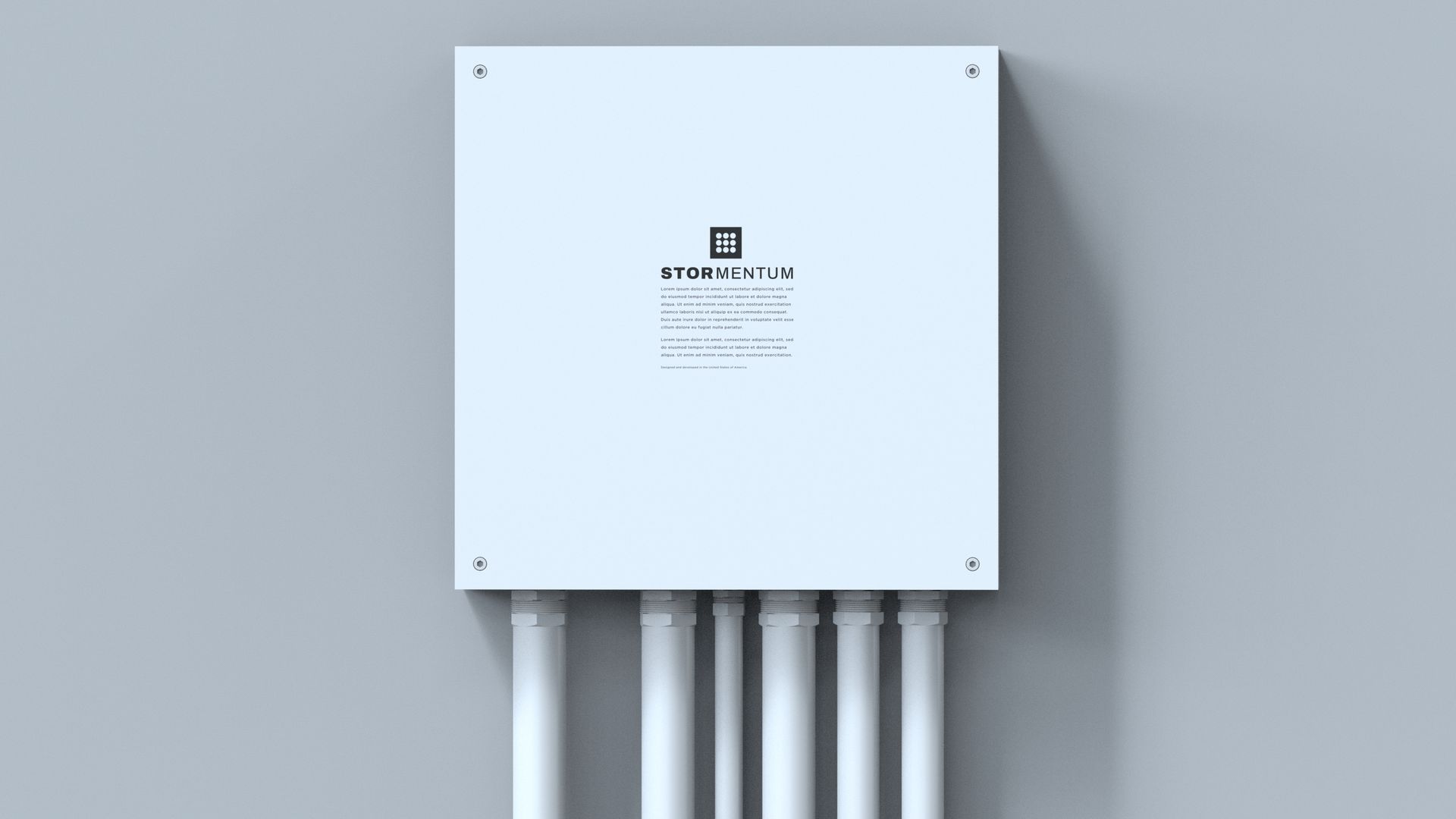 White rectangular electrical box labeled STORMENTUM with six white conduit pipes running vertically from the bottom, mounted on a light gray wall.
