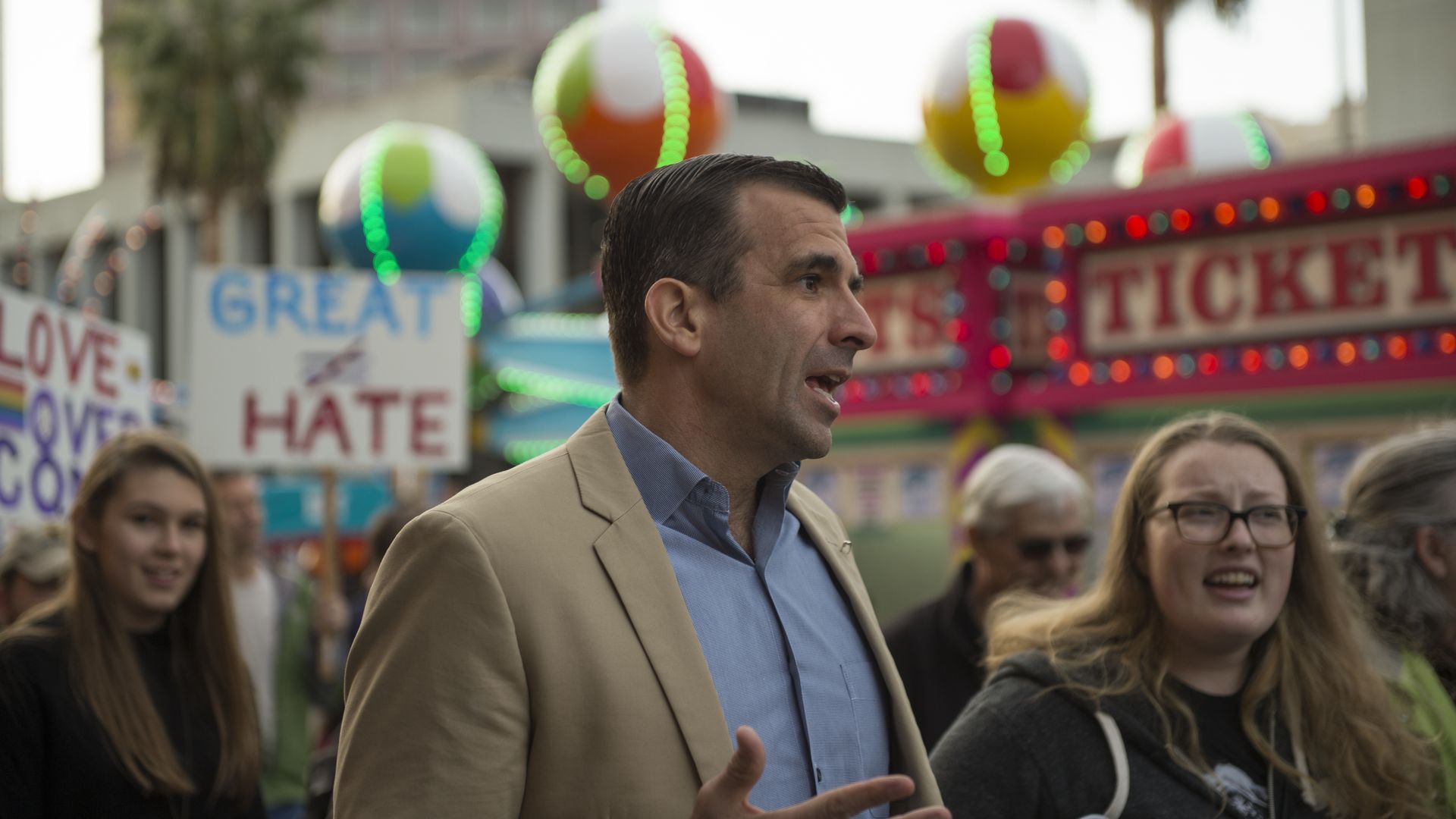 San Jose Mayor Sam Liccardo surrounded by people