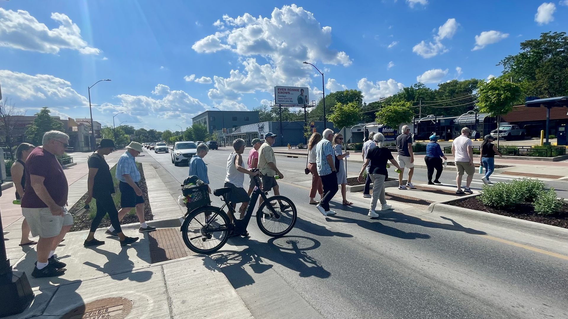 A photo of Axios Des Moines members walking on Ingersoll Avenue.