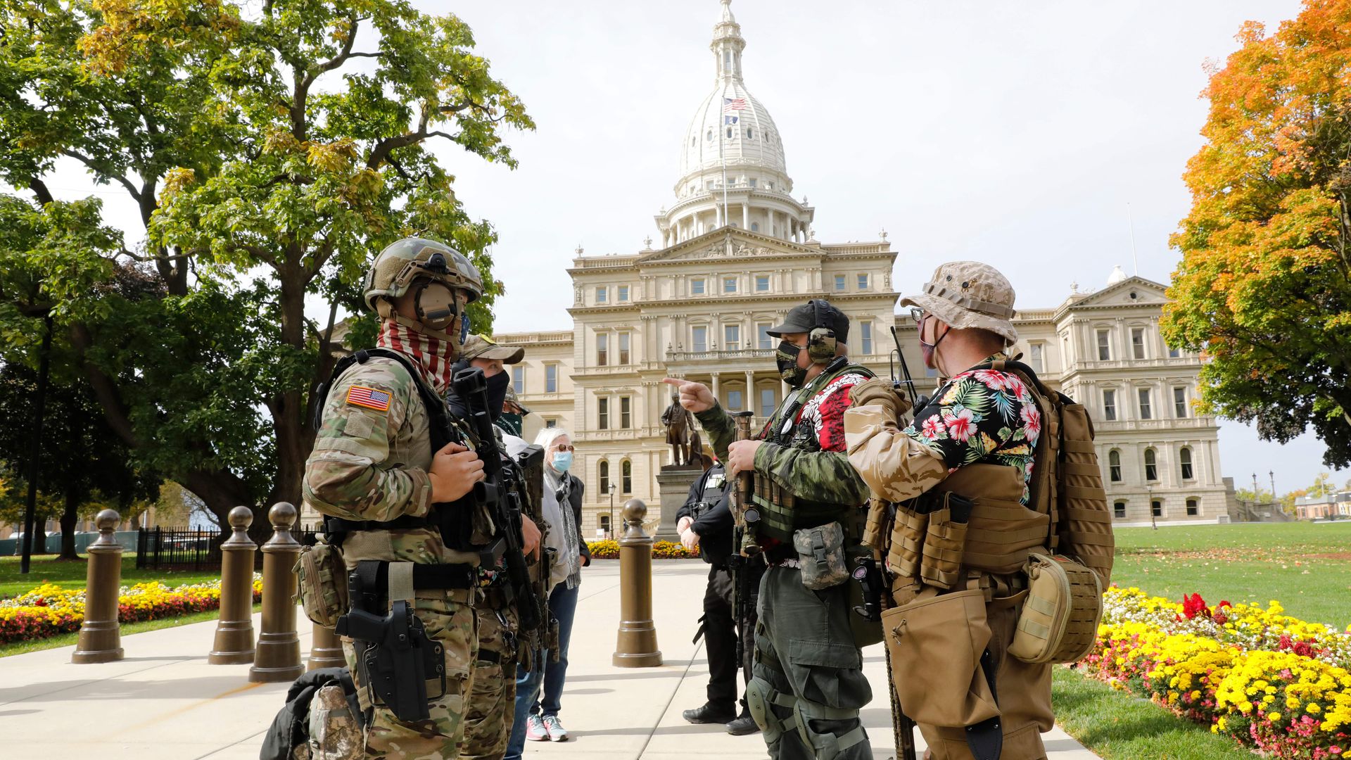 People carrying firearms at the Michigan State Capitol in Lansing, Michigan, on Oct. 17.