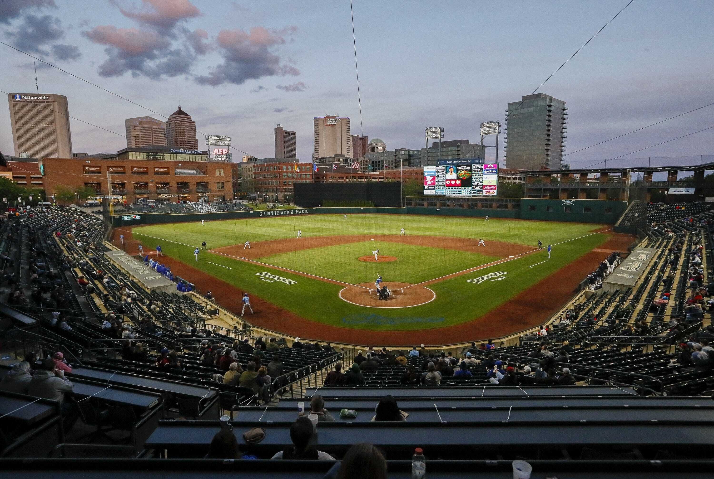 skyline in background of baseball field