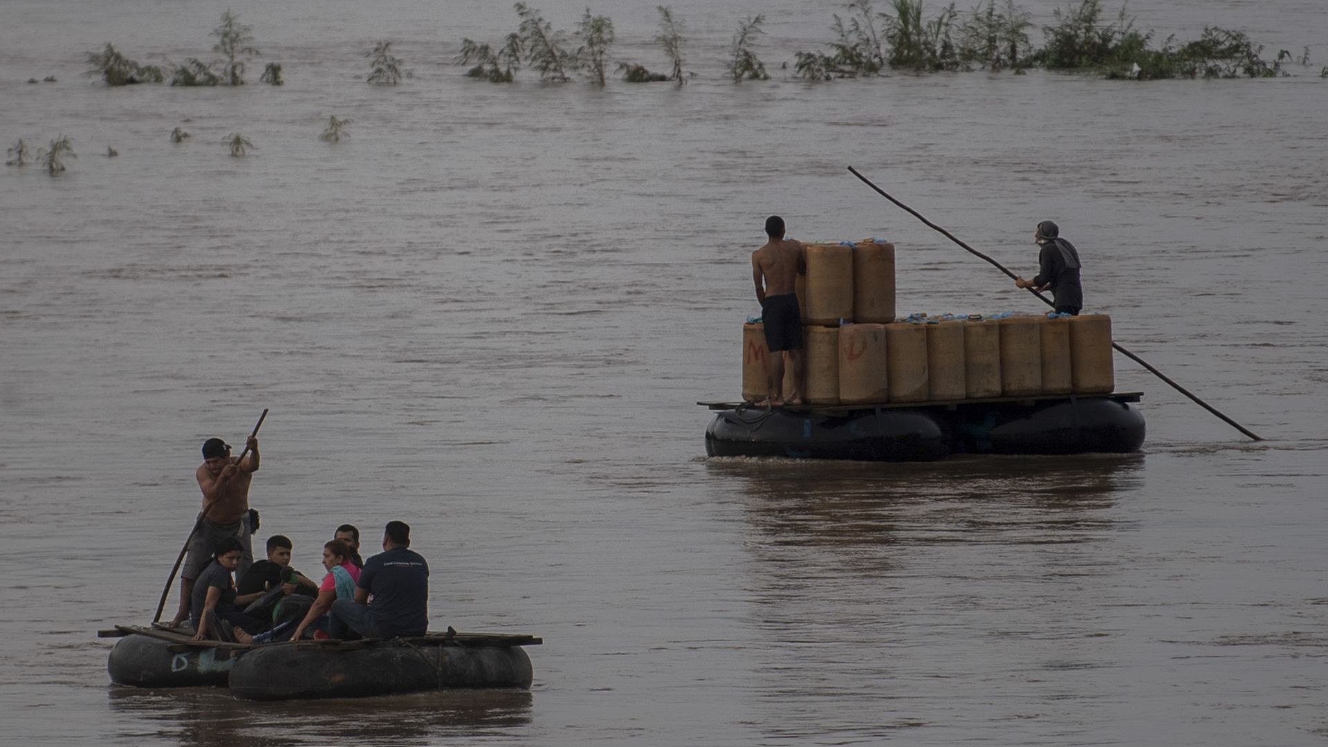 Migrants use rafts to cross the Suchiate river from Ciudad Hidalgo in Chiapas State, Mexico, to Tecun Uman in Guatemala