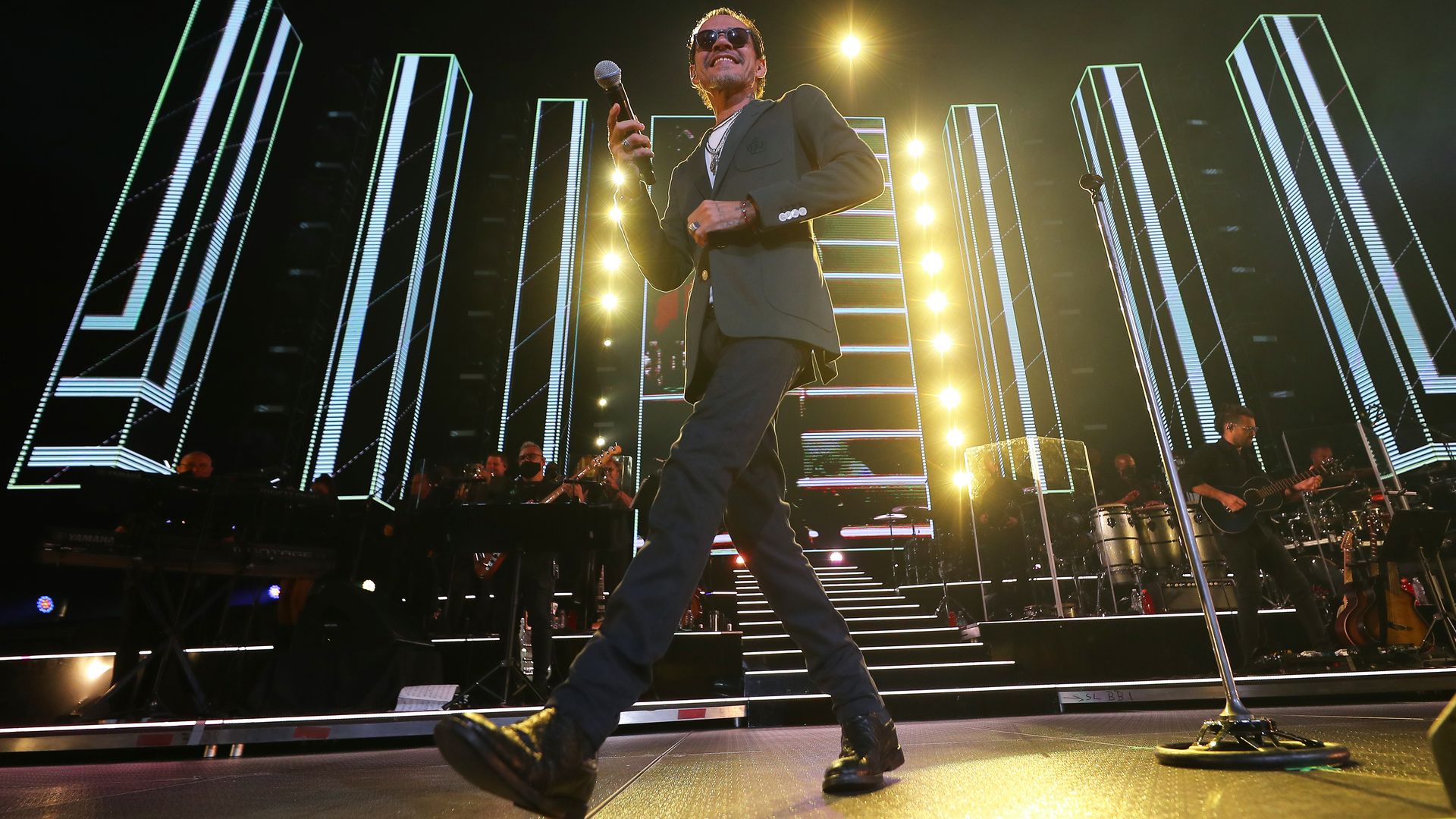 Marc Anthony on a lit up stage