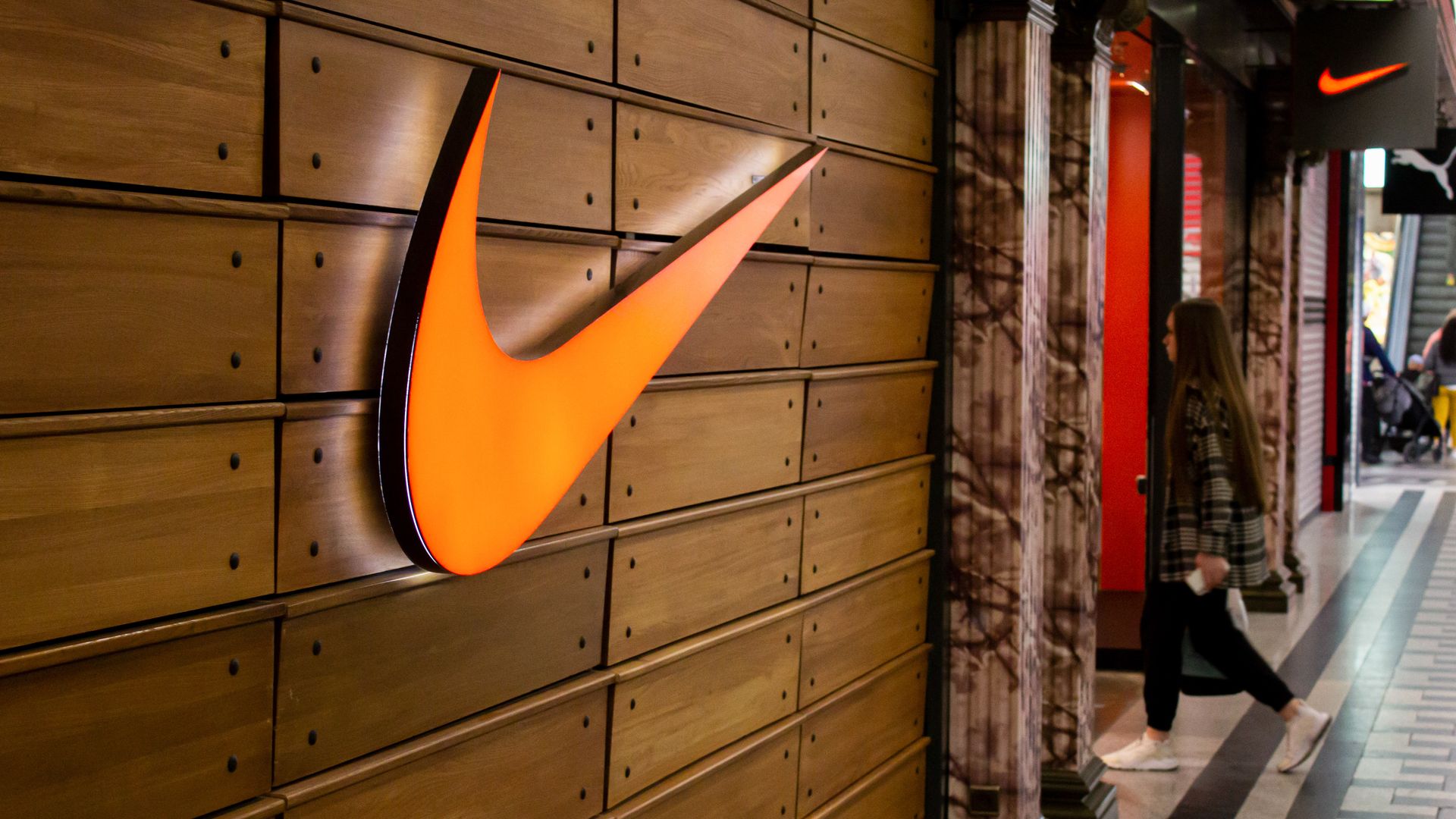  A woman walks into a Nike boutique in a shopping mall in Moscow