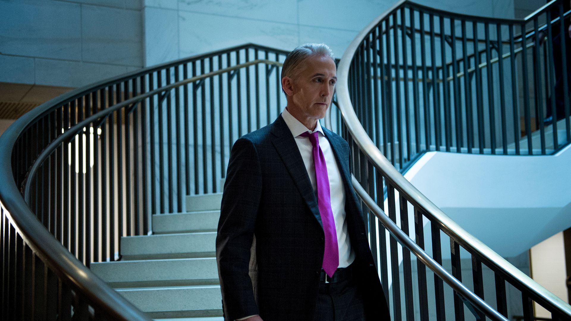 Trey Gowdy walks down a flight of stairs