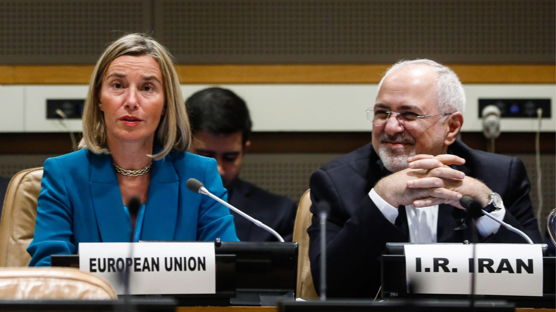EU representative sitting next to Iran president