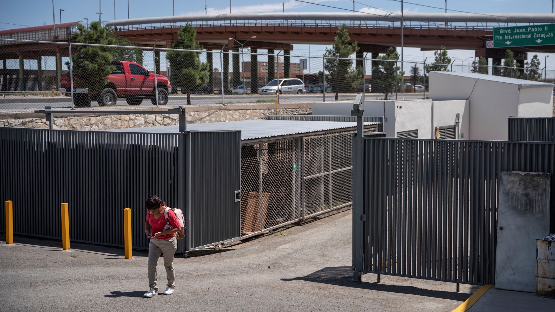 This image shows a child walking out of a detention center.