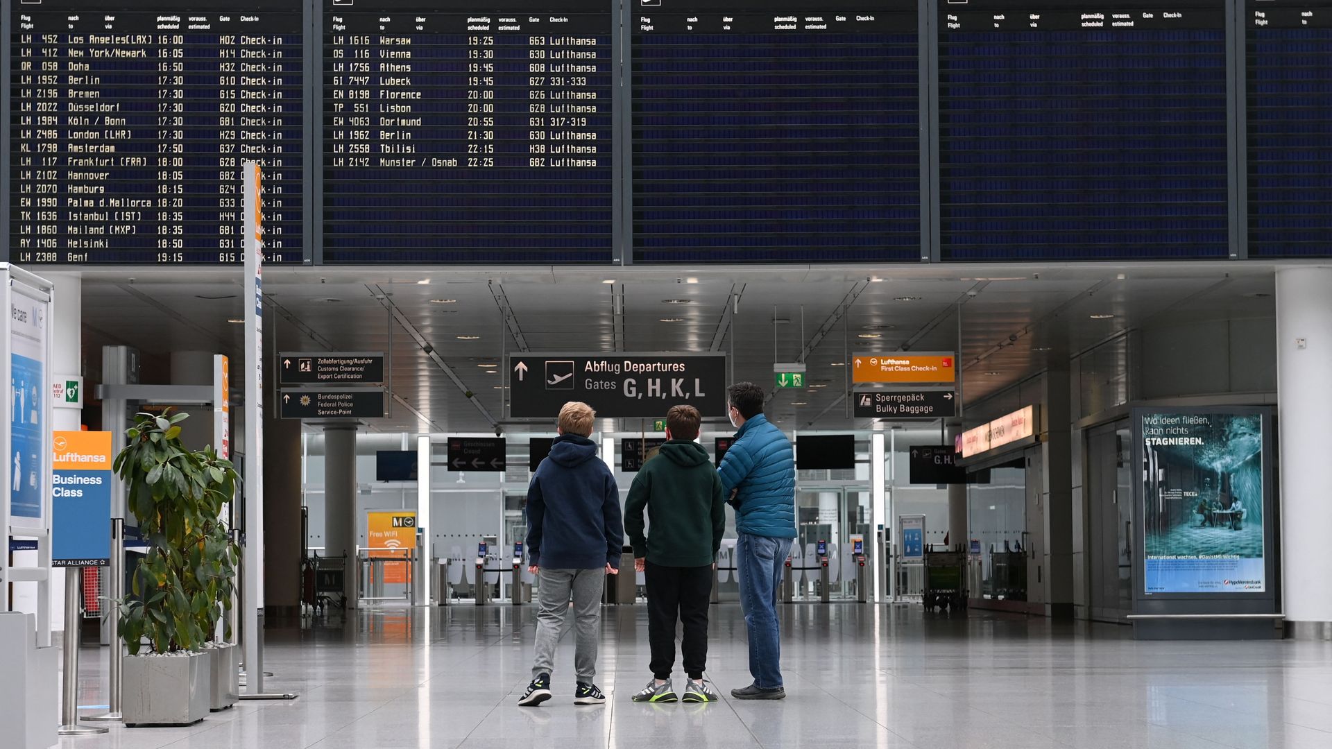 Picture of three people in a German airport
