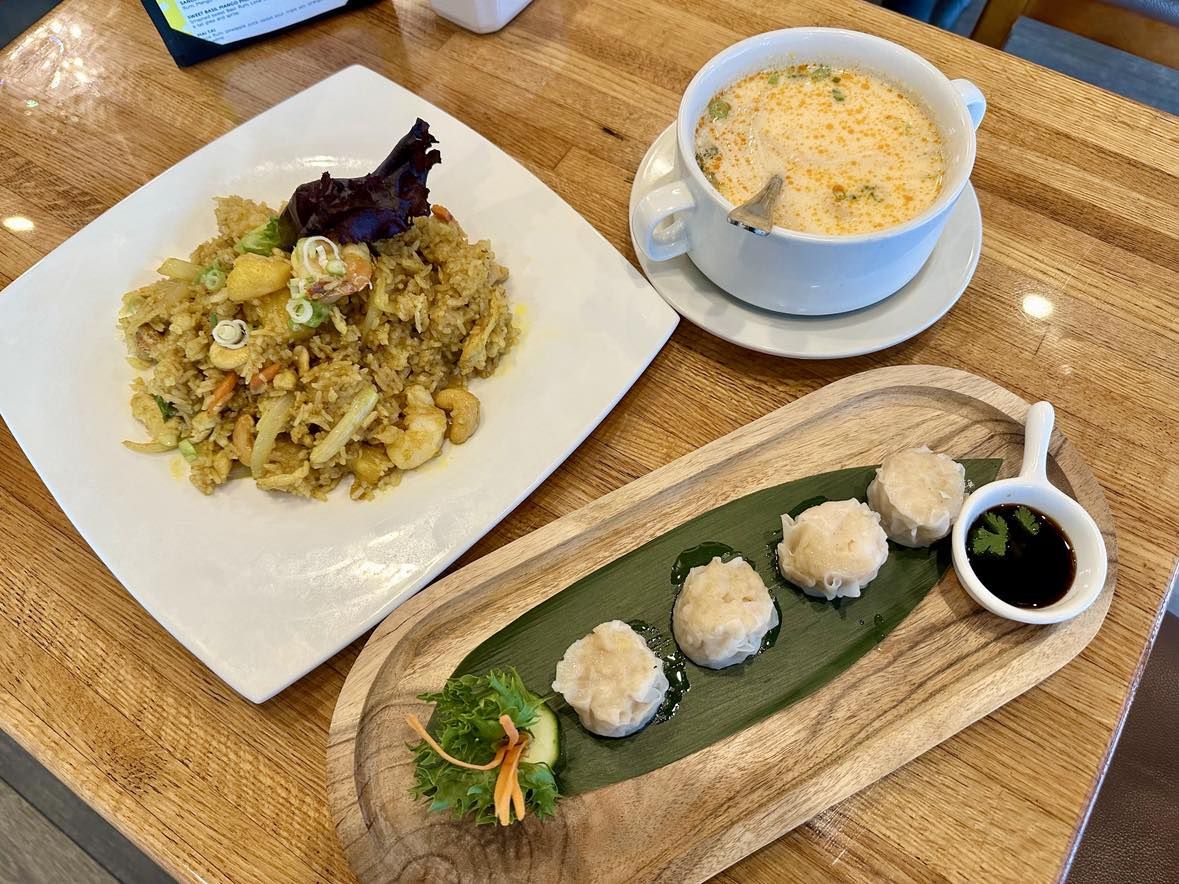 Photo shows three Thai dishes on a table