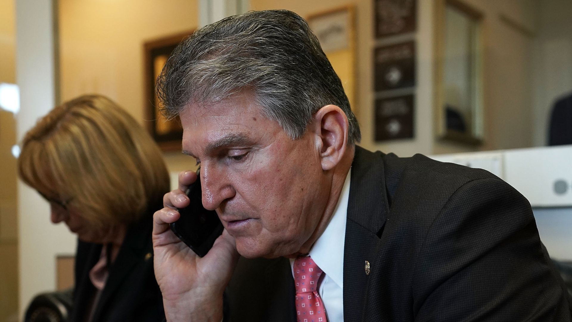 Senator Joe Manchin on a cell phone