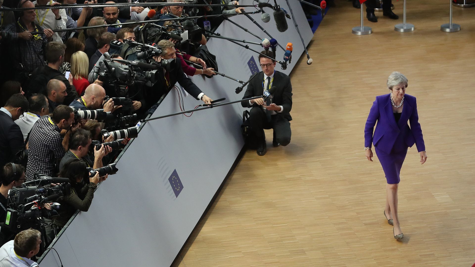 British Prime Minister Theresa May finishes speaking to the media as she arrives for the October summit of European Union leaders on October 18, 2018.