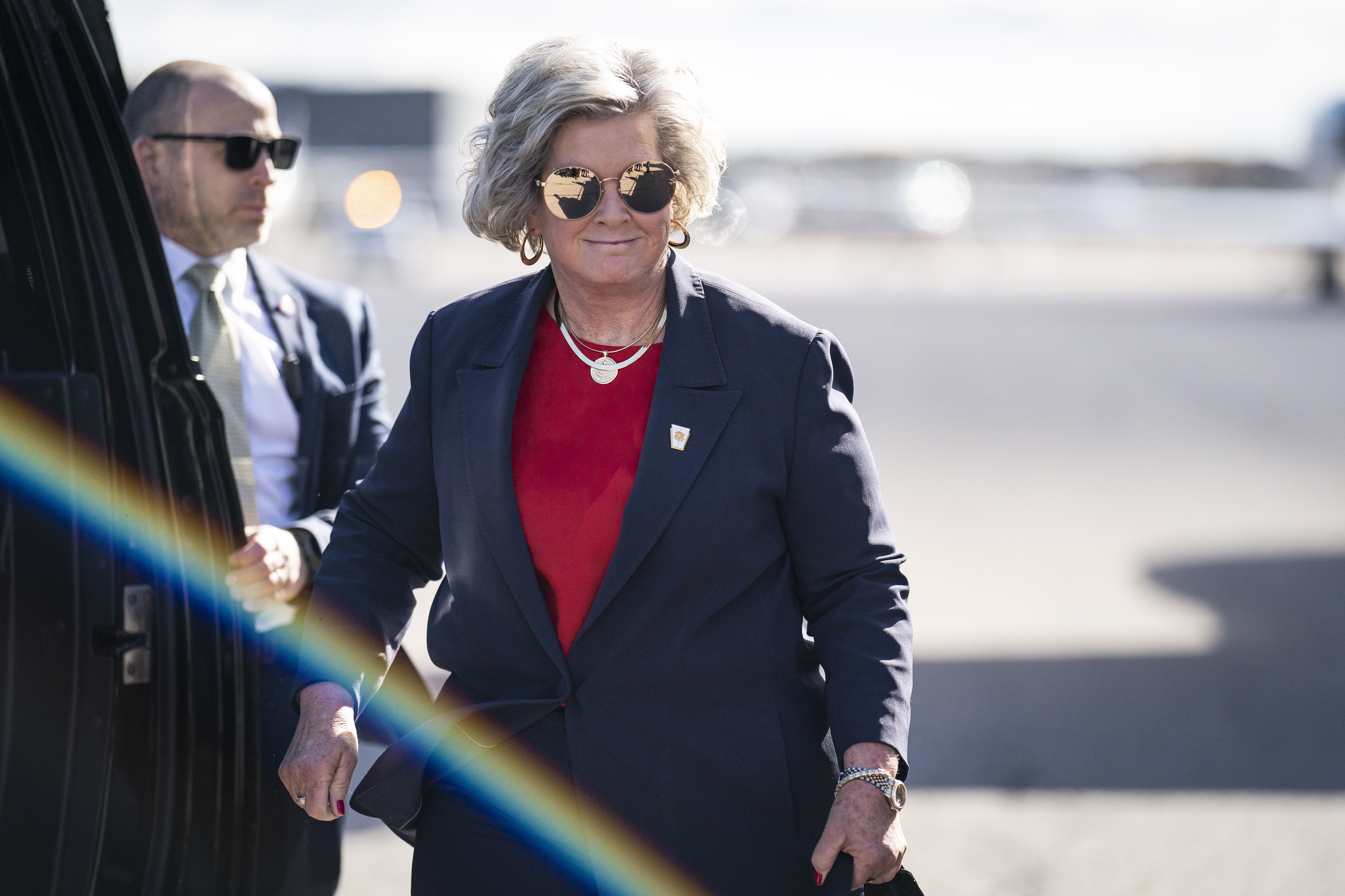 Susie Wiles and Donald Trump walk down the stairs of Trump Force One after landing at Manchester-Boston Regional Airport in Londonderry, New Hampshire.