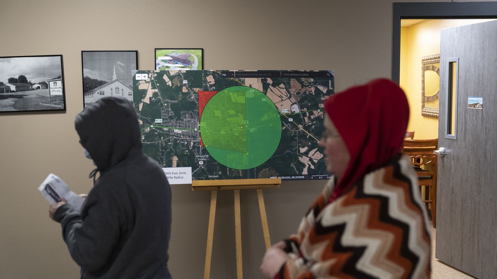 People wait in line at the Norfolk Southern Assistance Center.