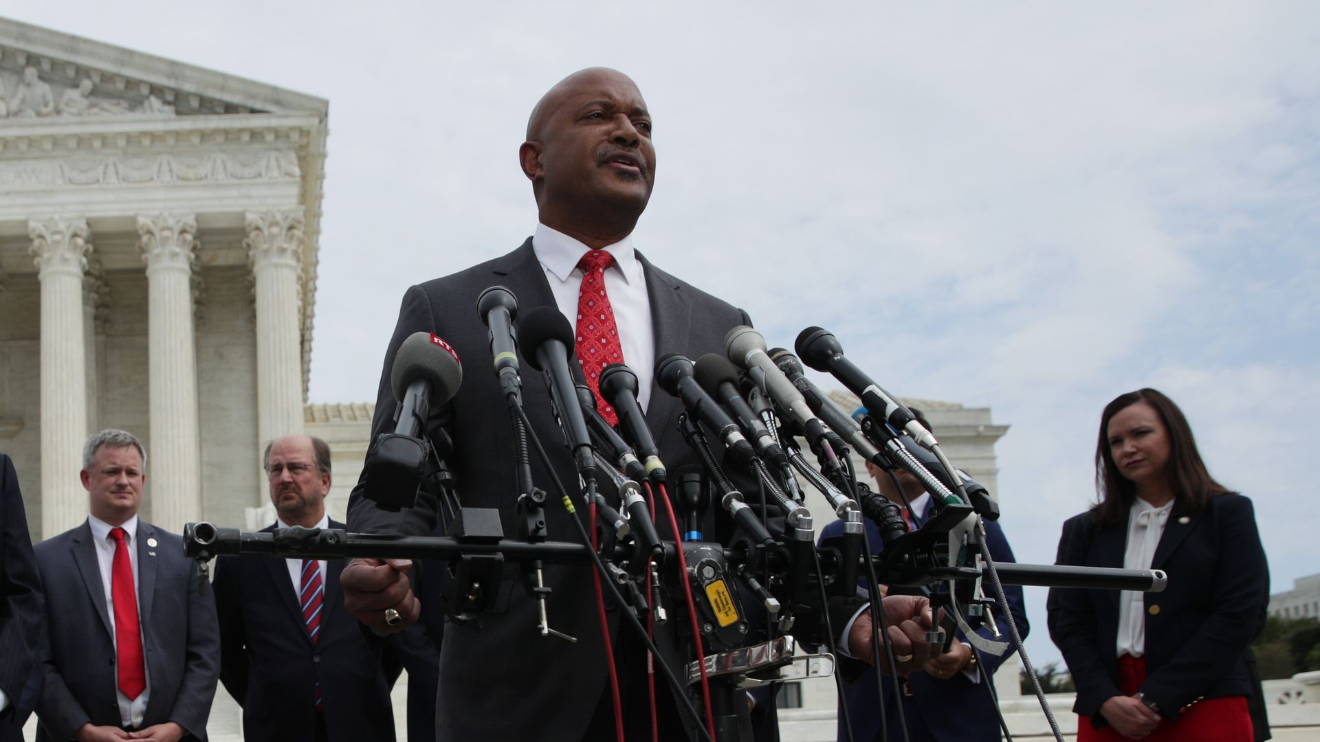 Indiana Attorney General Curtis Hill speaks as Washington, DC Attorney General Karl Racine at a news conference