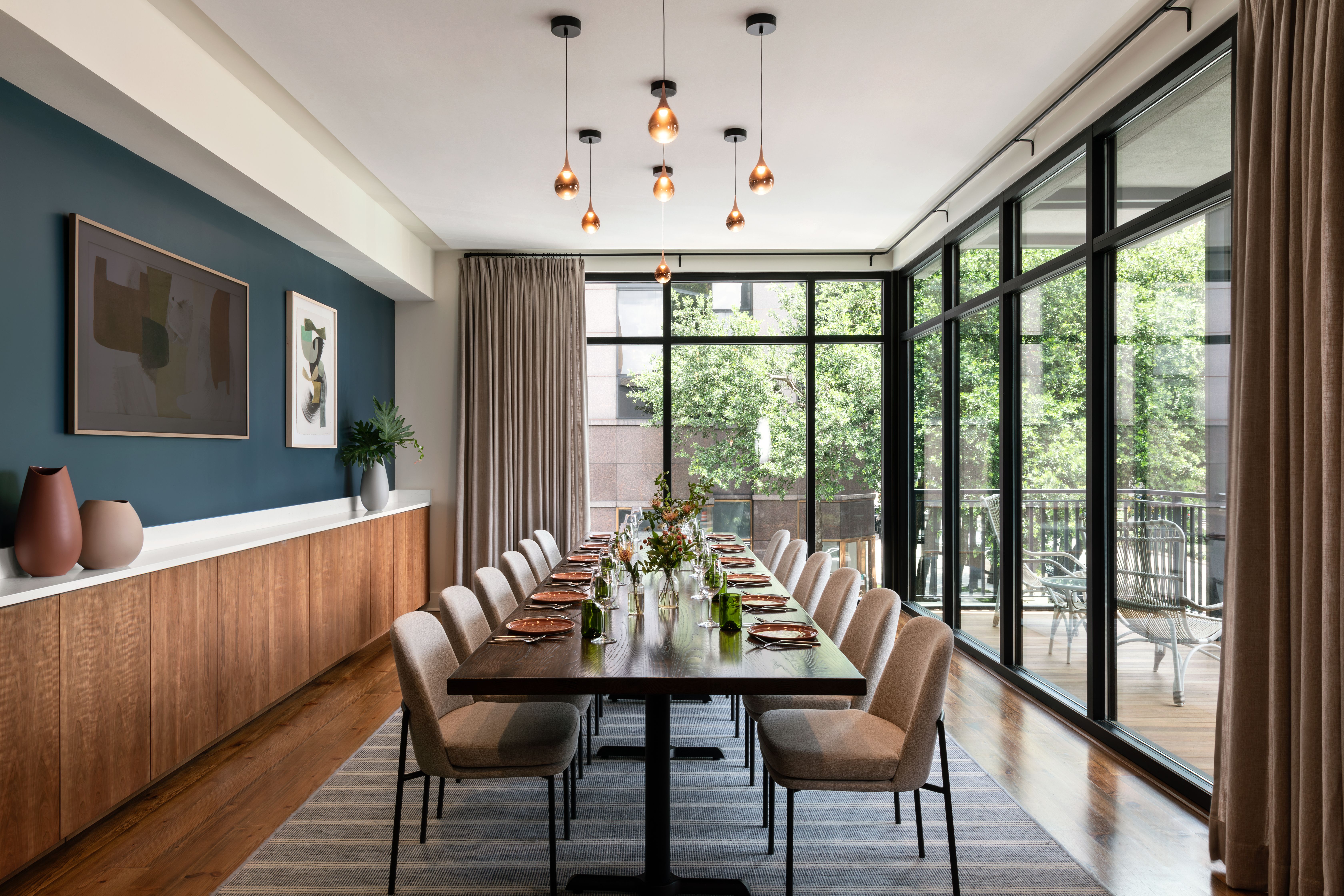 A dining room is set with a table for 14.