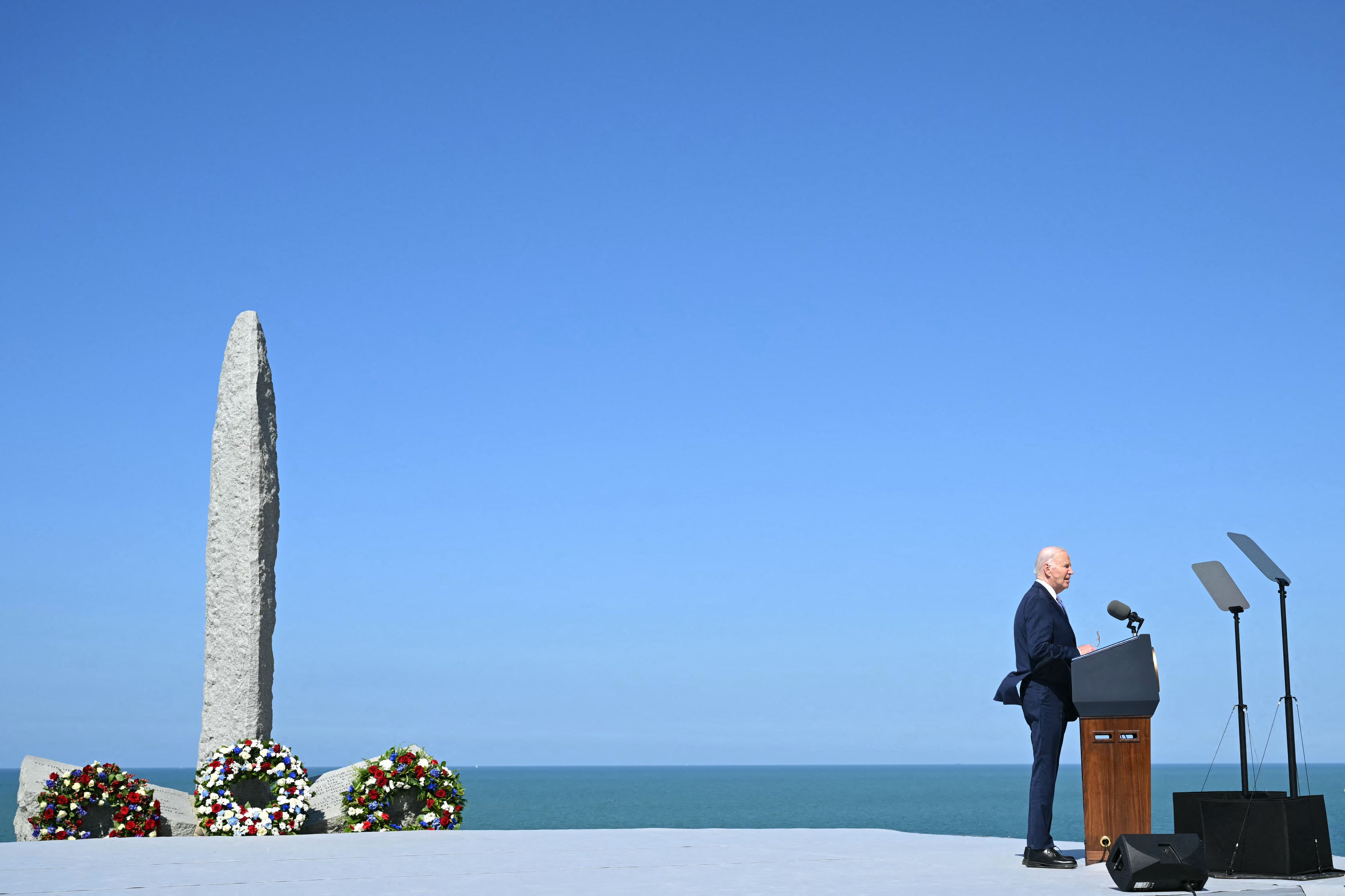 President Joe Biden delivers a speech near the monument at “Pointe du Hoc” today. Photo: Saul Loeb / AFP via Getty Images