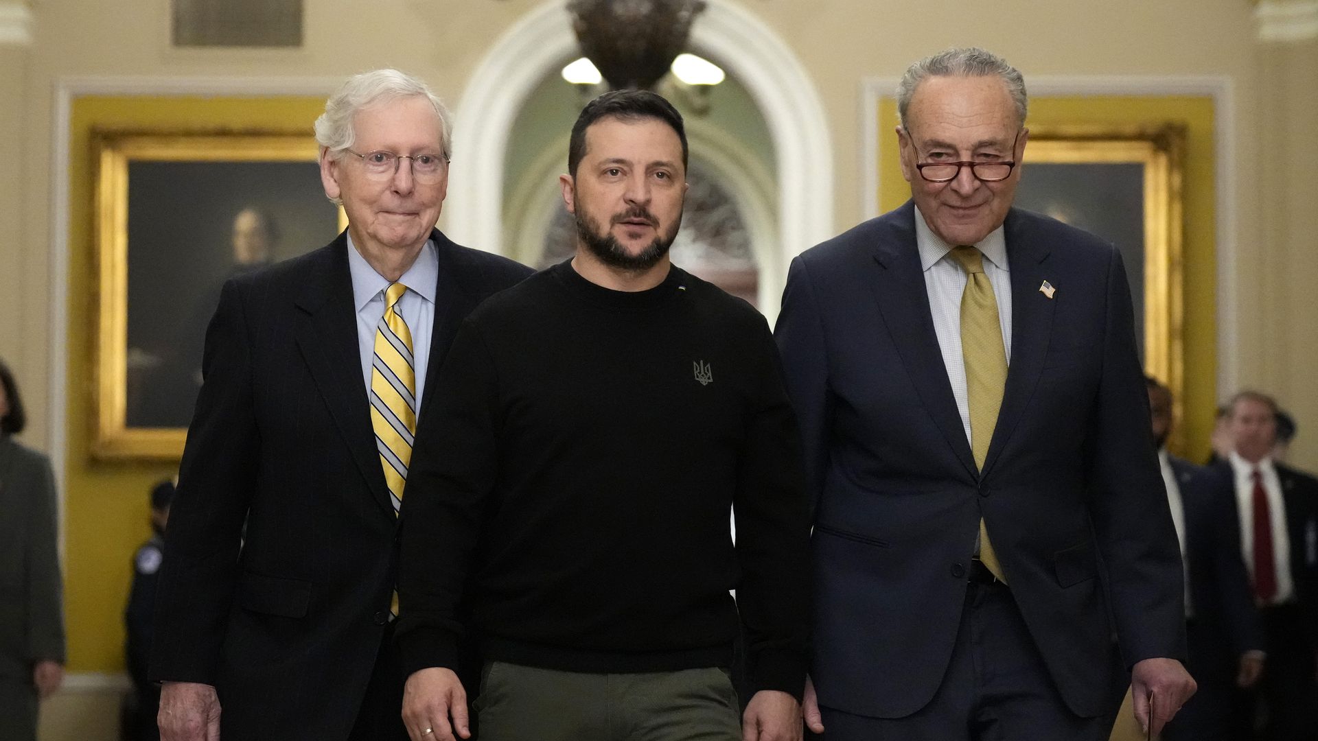 Ukrainian President Volodymyr Zelensky (C) walks with Senate Minority Leader Mitch McConnell (R-KY) (L) and Senate Majority Leader Charles Schumer (D-NY) as he arrives at the U.S. Capitol to meet with Congressional leadership 