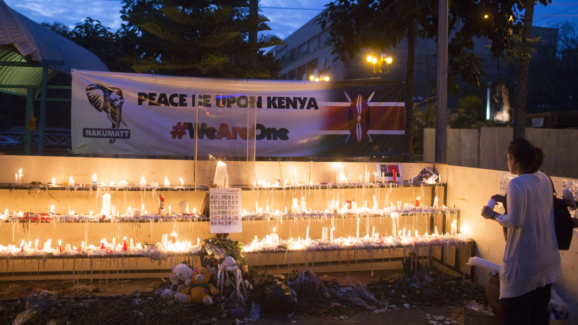 People light candles for the victims of the attack outside the Westgate Shopping Centre on September 29, 2013 in Nairobi, Kenya.