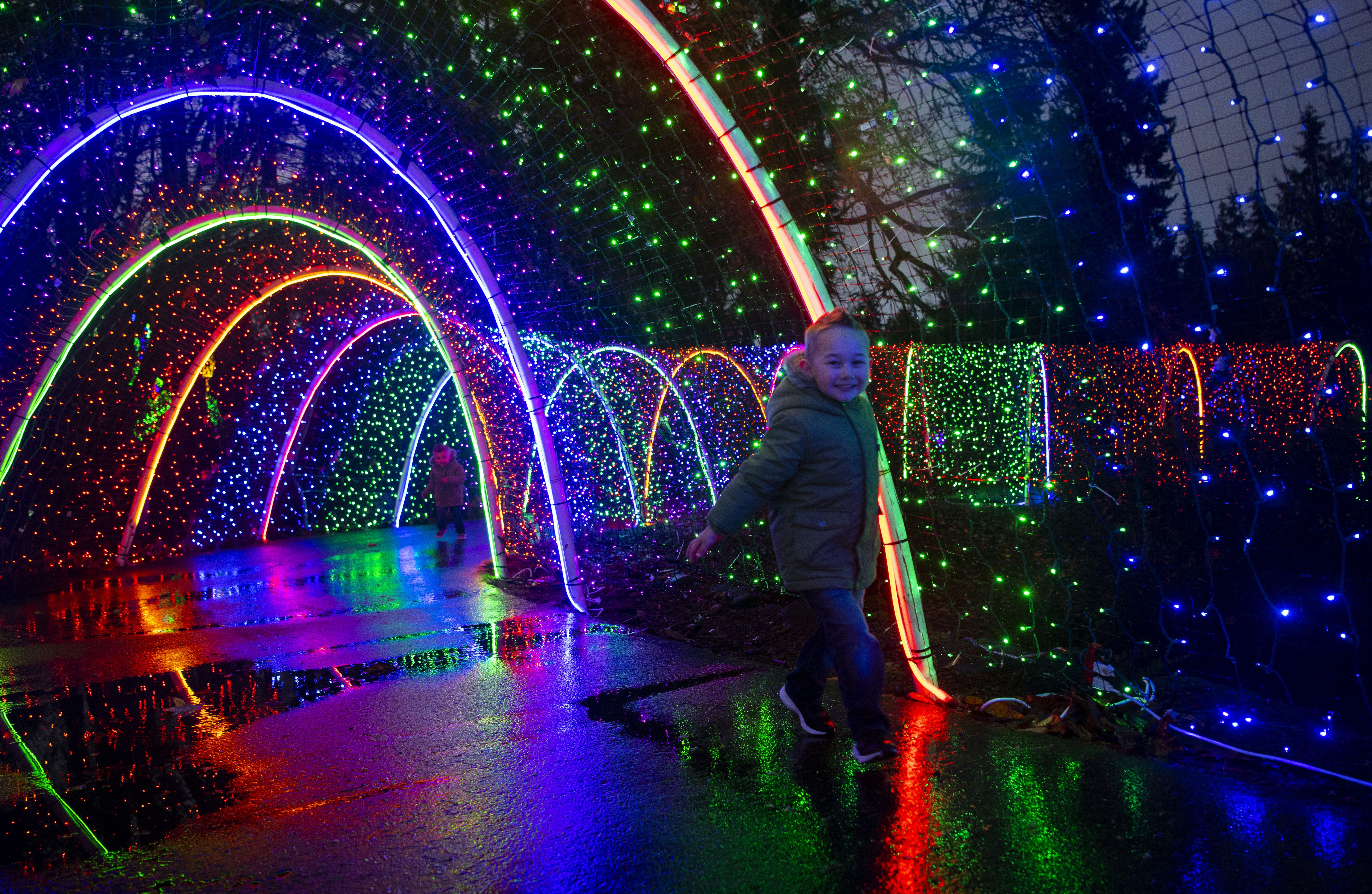 Arches of lights with a child running through.