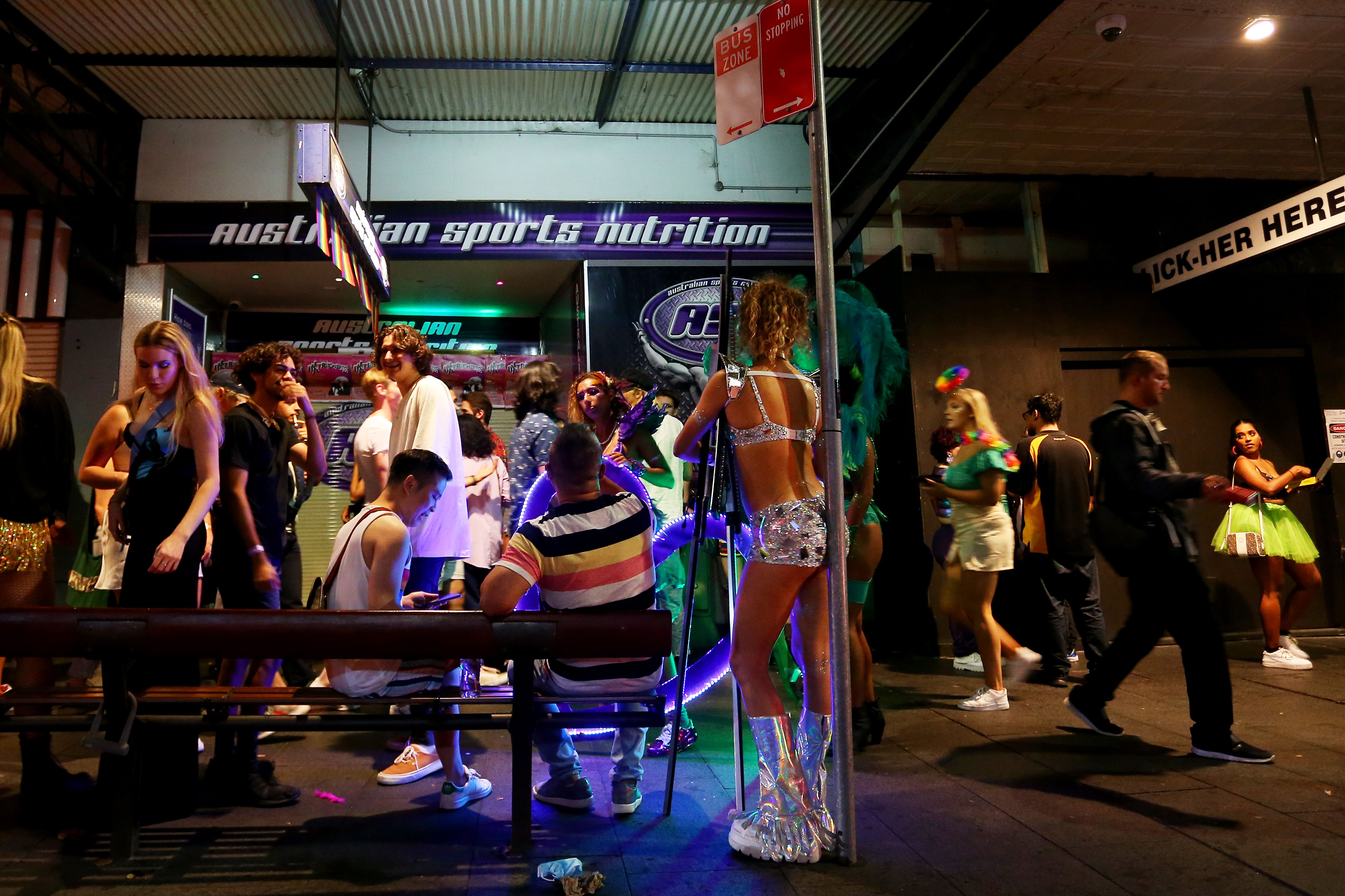 People line Oxford Street following the Sydney Gay and Lesbian Mardi Gras parade on March 06