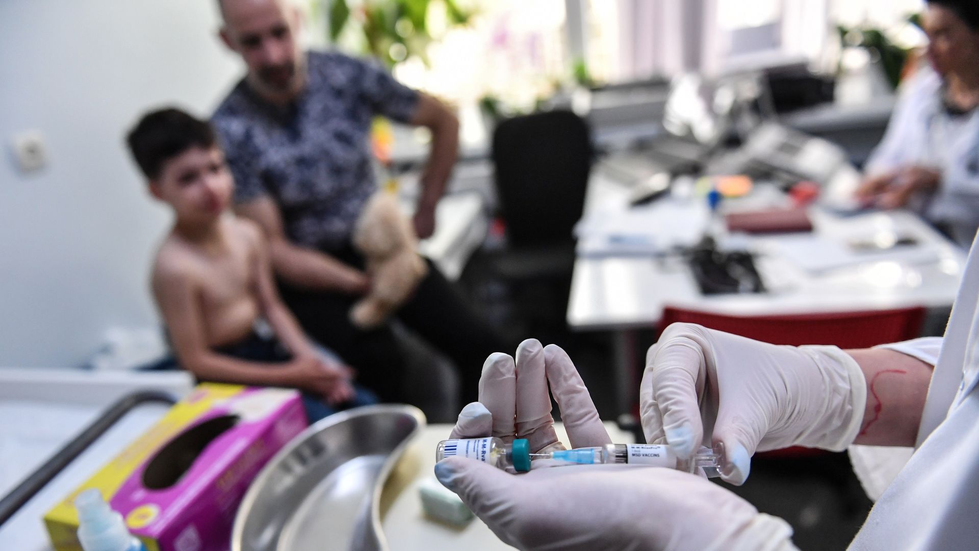 A family physician prepares a measles vaccine during a consultation on April 16, 2018 in the Romanian capital, Bucharest.