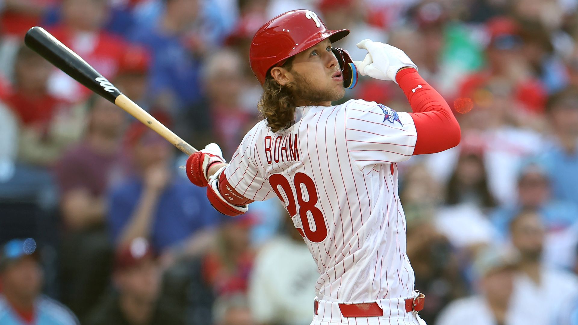 The Phillies Alec Bohm, watching his three-run home run drift over the fence at Citizens Bank Park