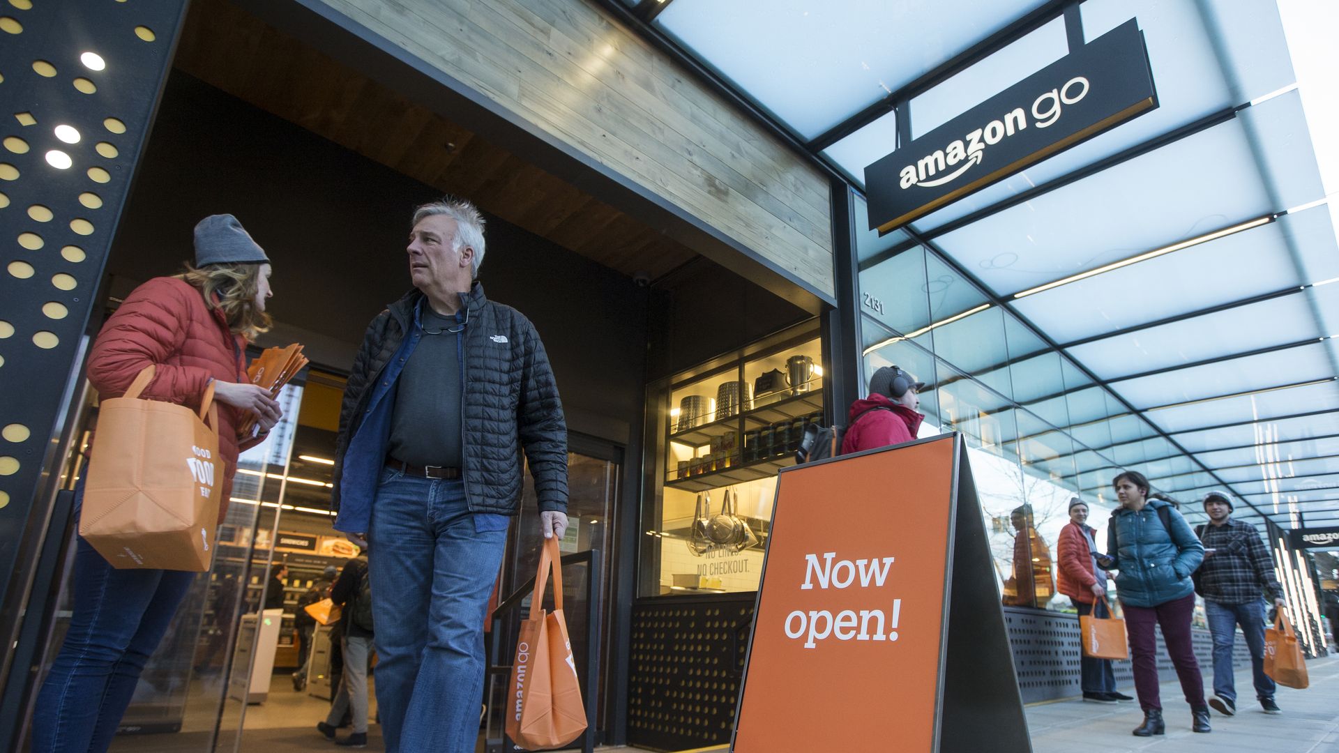 A shopper walks out the the Amazon Go store, on January 22, 2018 in Seattle, Washington. After more than a year in beta Amazon opened the cashier-less store to the public. 