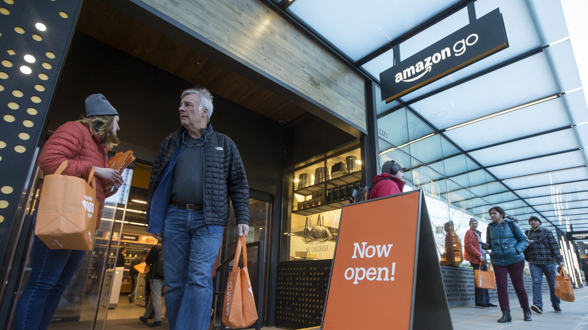 A shopper walks out the the Amazon Go store, on January 22, 2018 in Seattle, Washington. After more than a year in beta Amazon opened the cashier-less store to the public.
